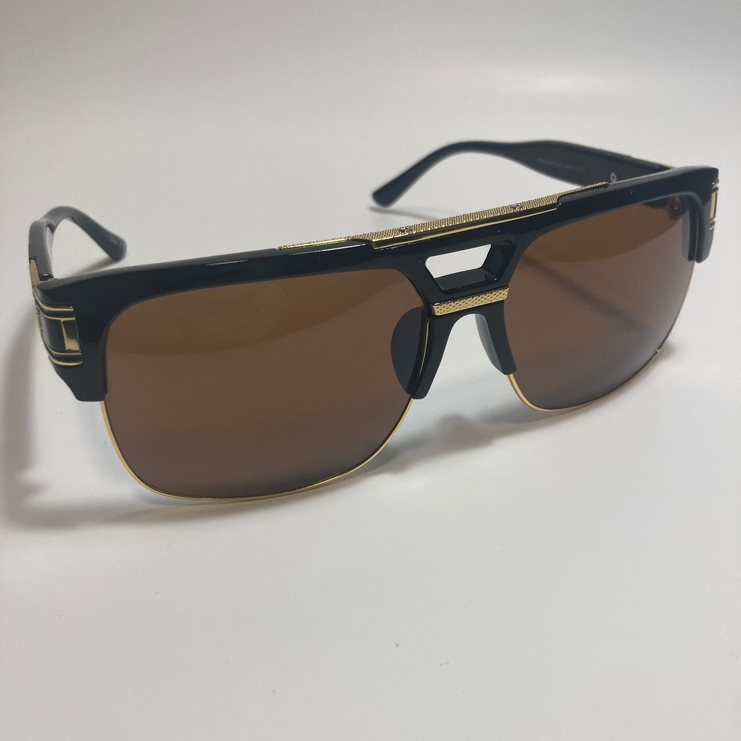 black, brown, and gold gazelle sunglasses