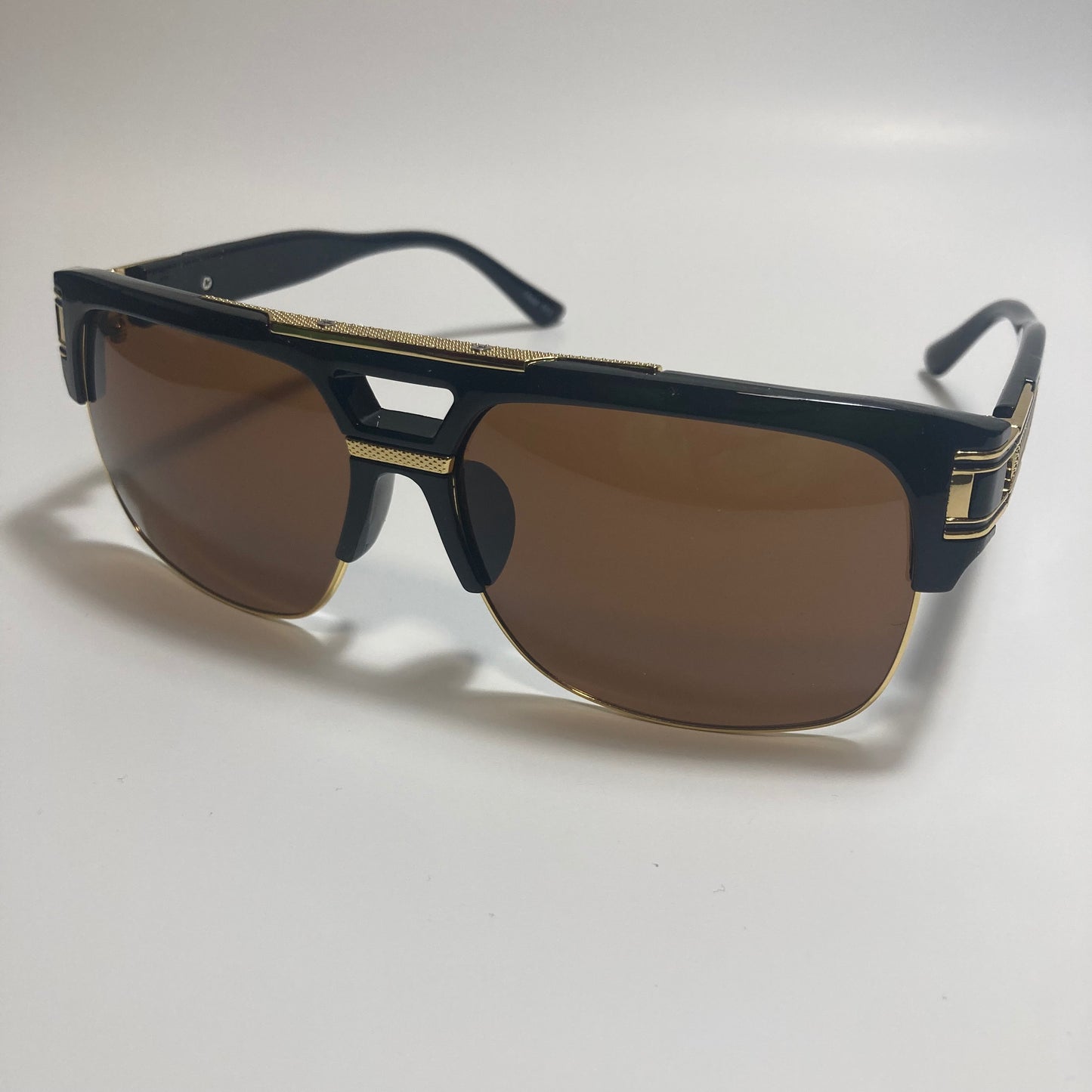 black, brown, and gold gazelle sunglasses