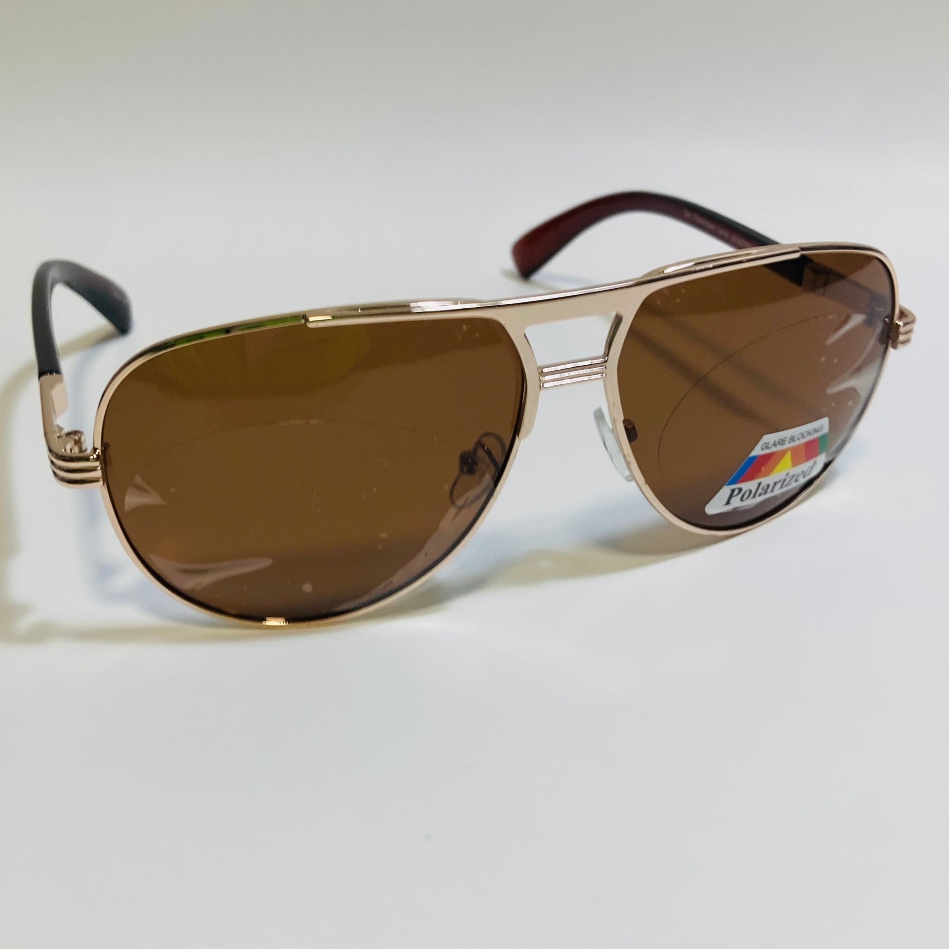 Polarized gold and brown aviator sunglasses with engraved metal frame
