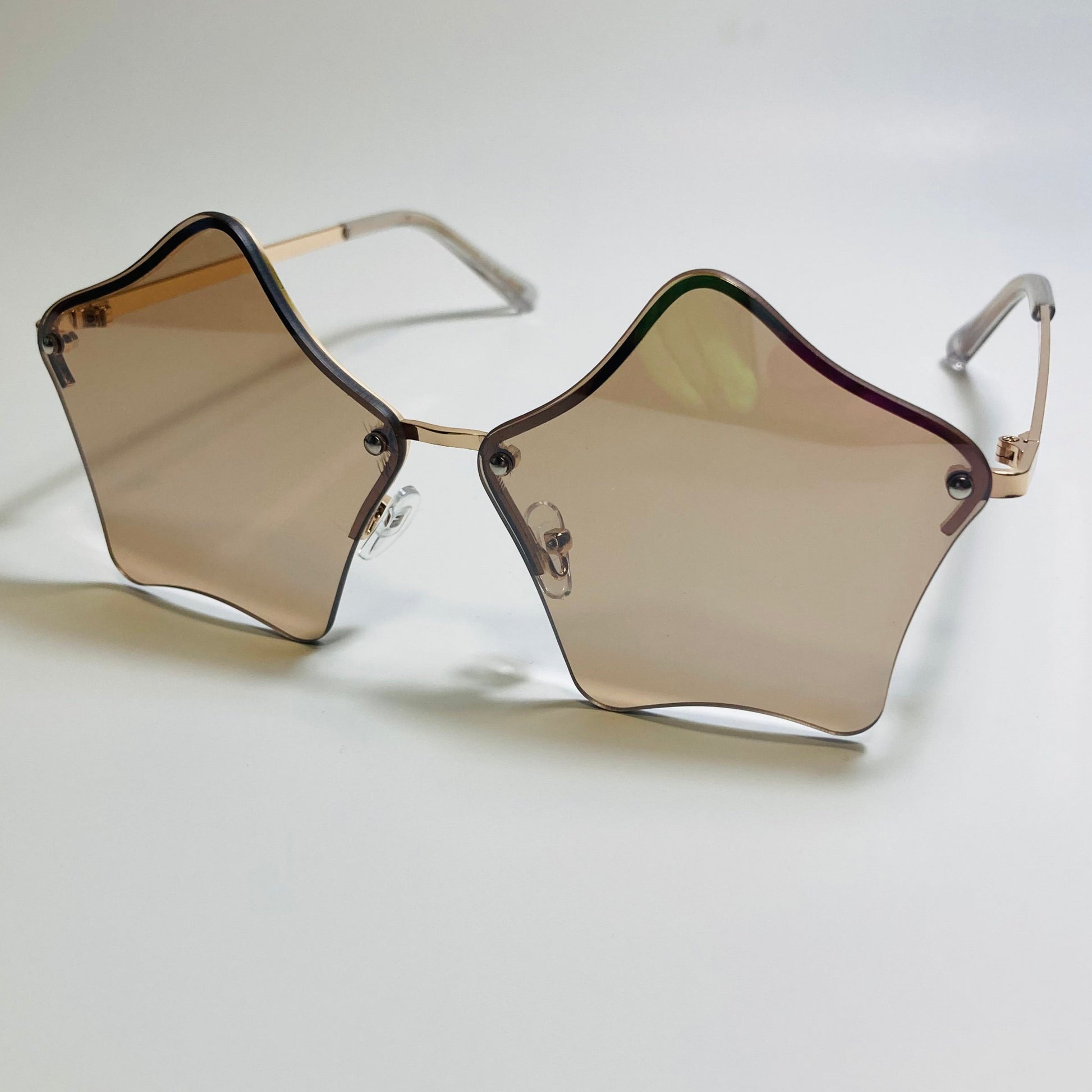 womens brown and gold star sunglasses with metal frame