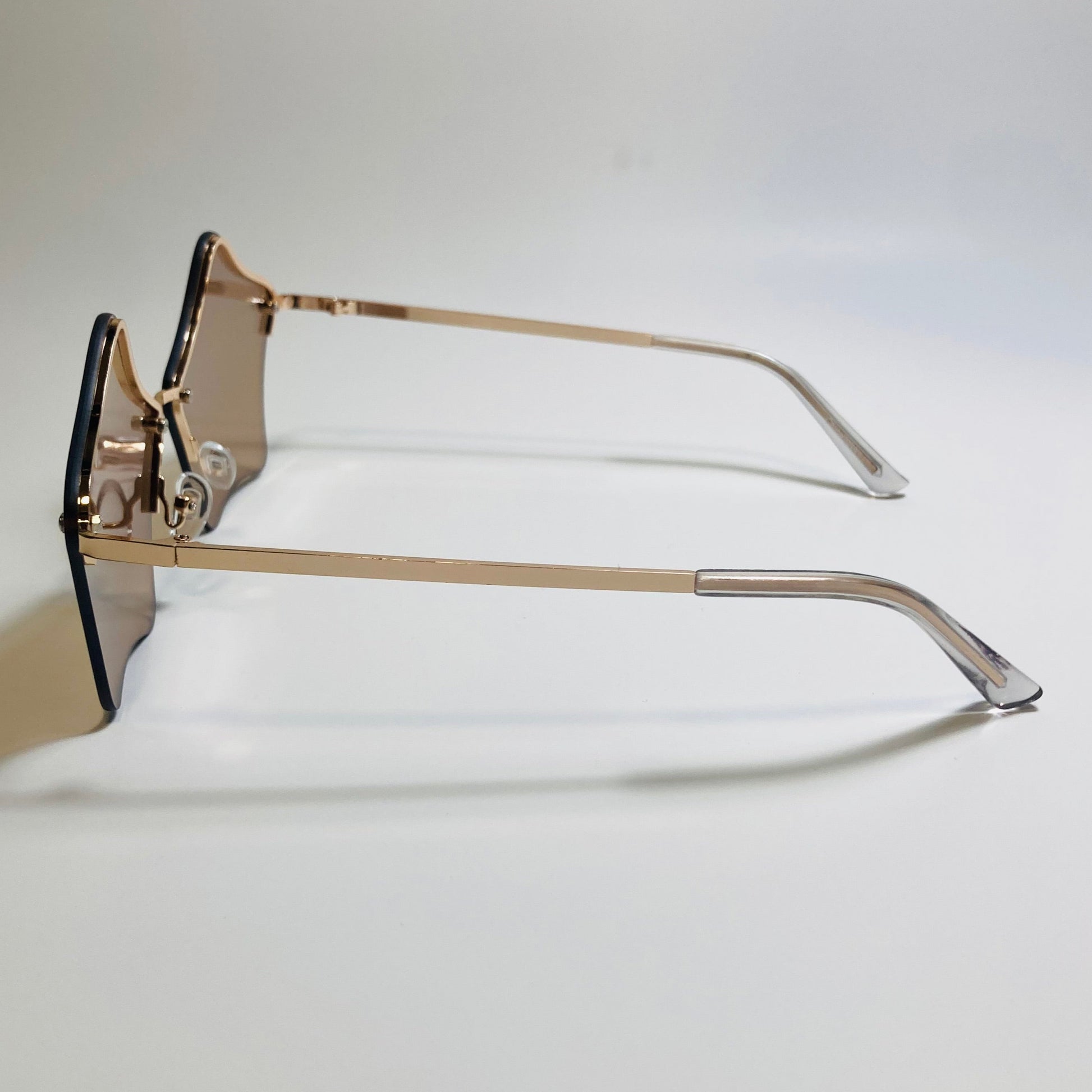 womens brown and gold star sunglasses with metal frame