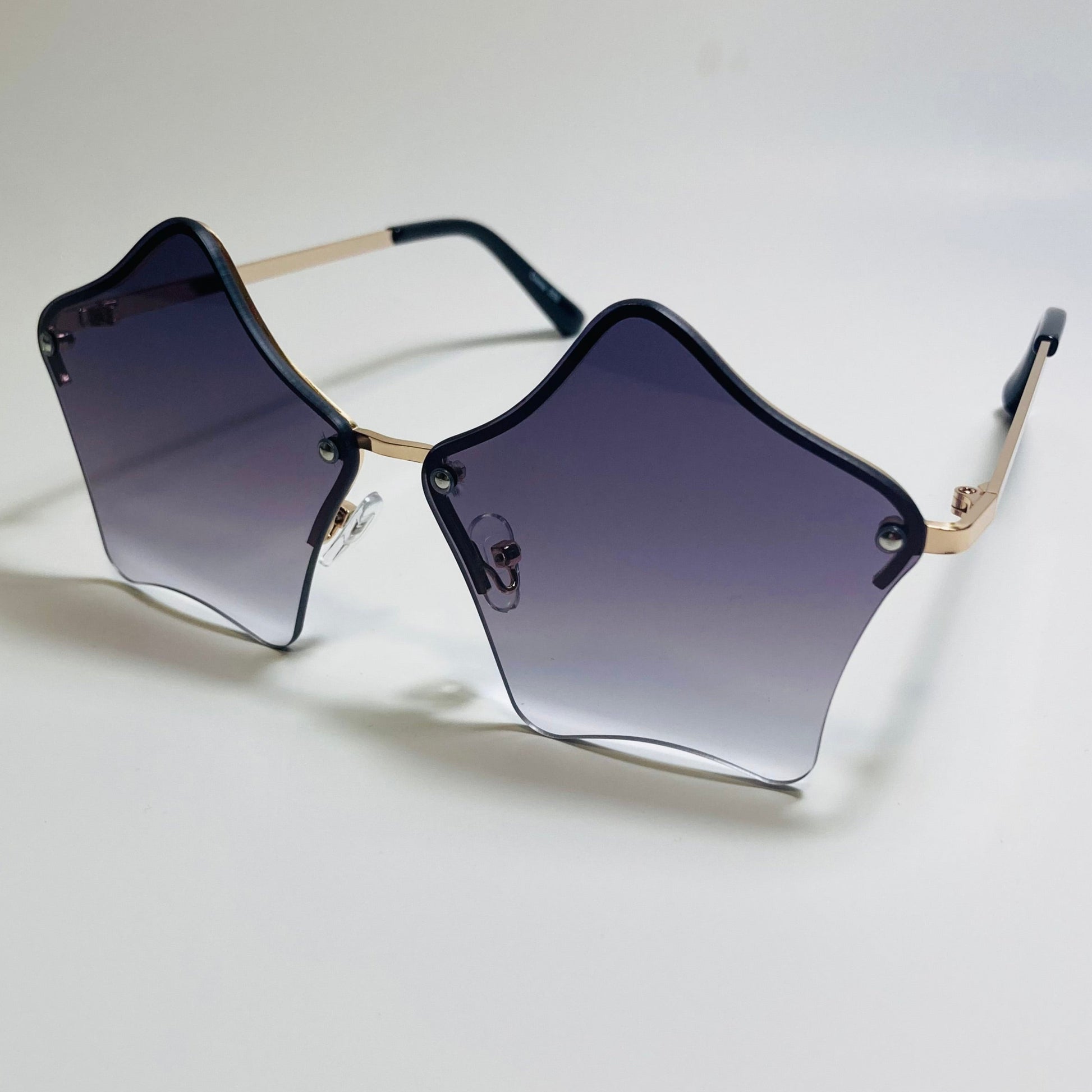 womens black and gold star sunglasses with metal frame
