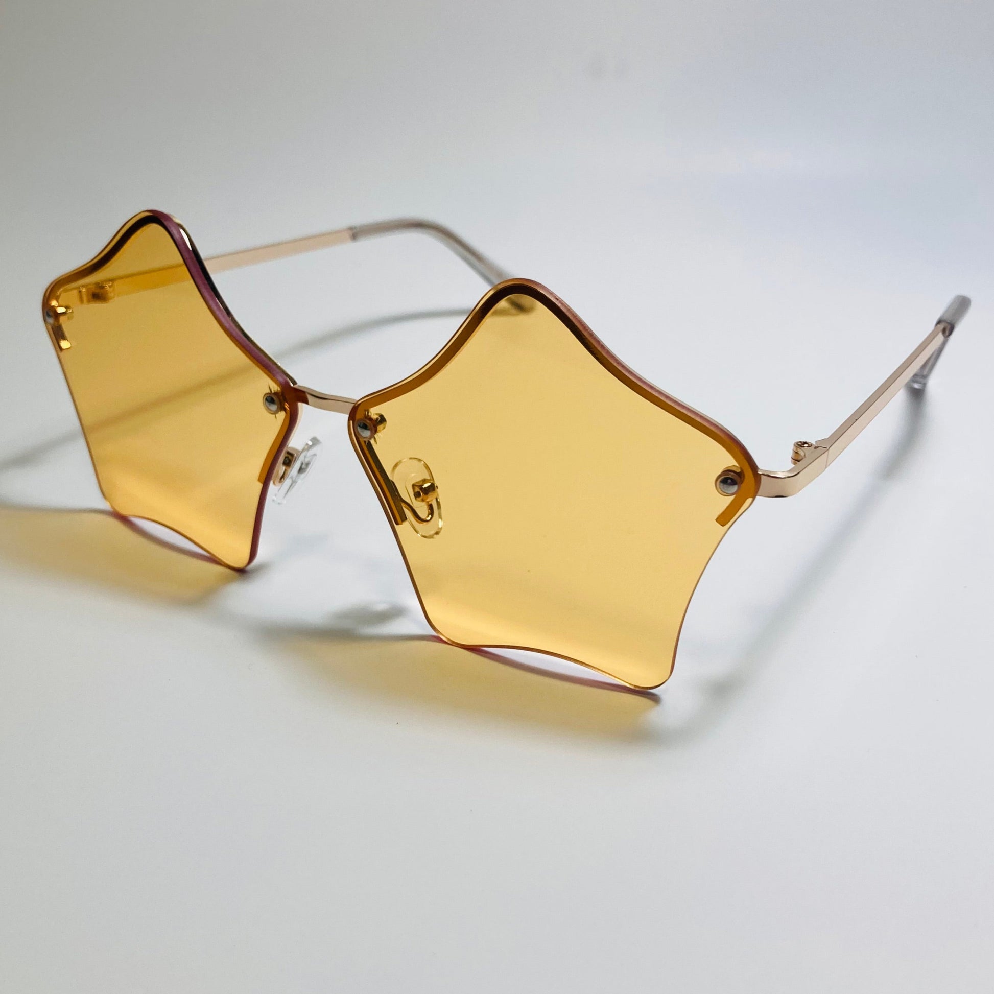 womens orange and gold star sunglasses with metal frame