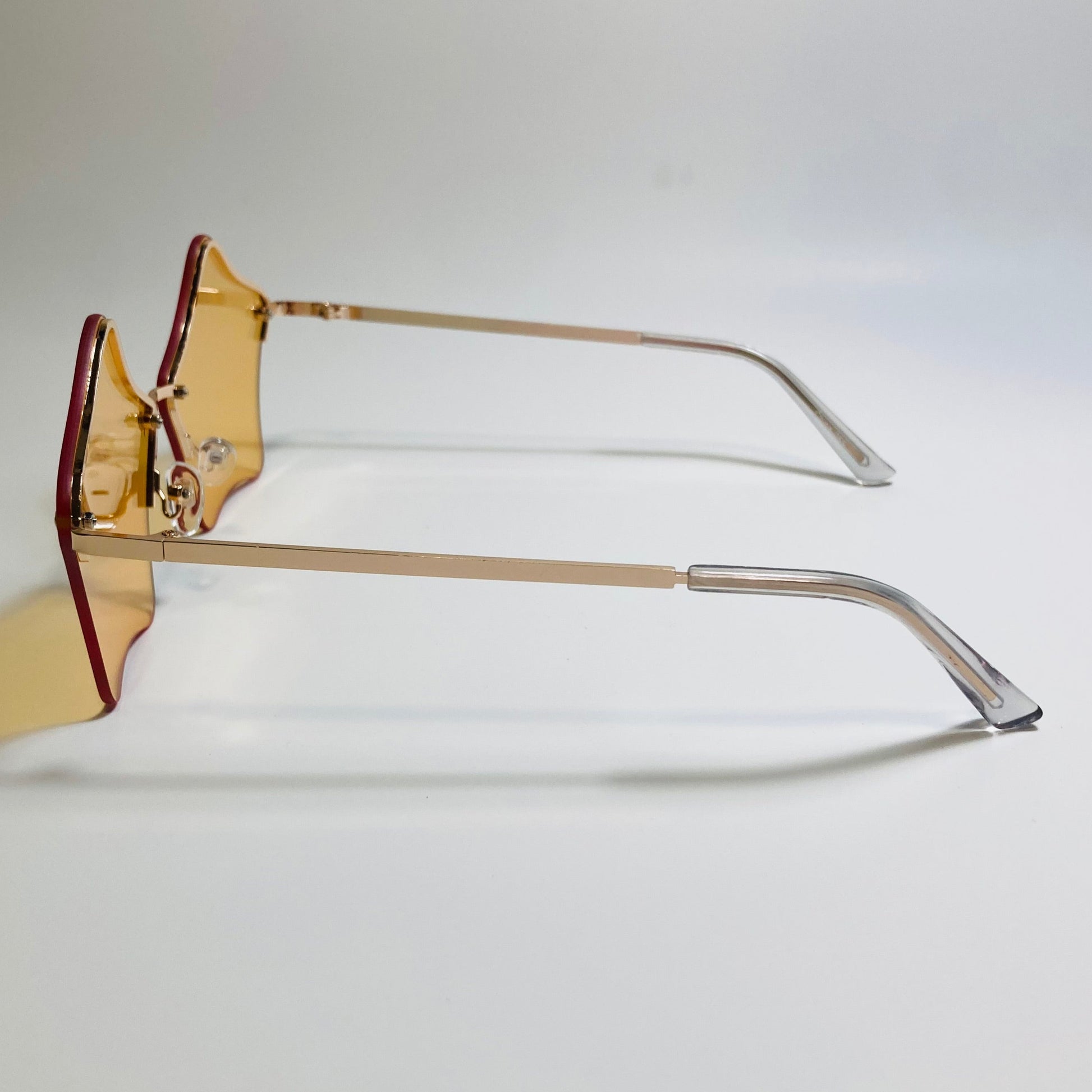 womens orange and gold star sunglasses with metal frame