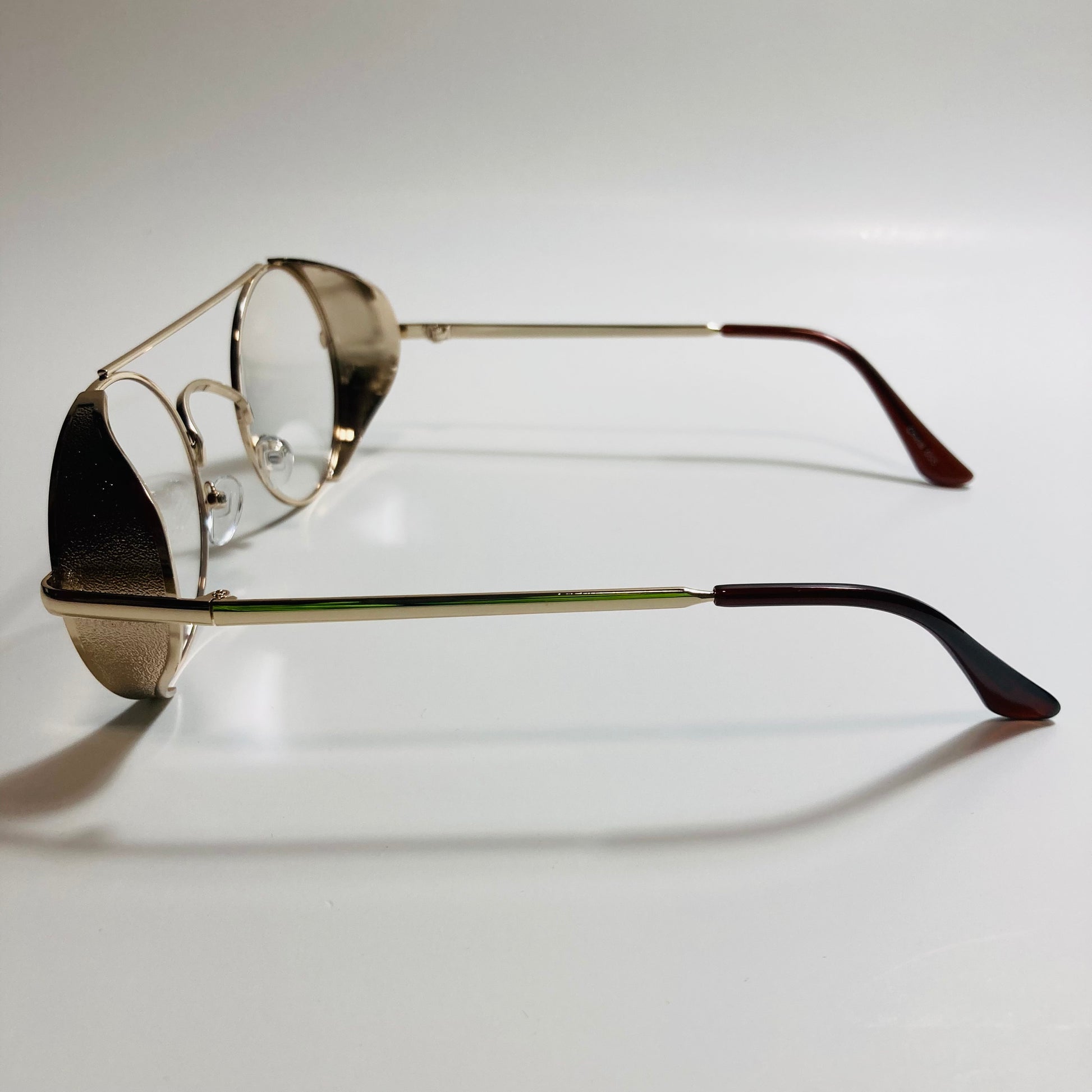 mens and womens white gold round glasses with side shields