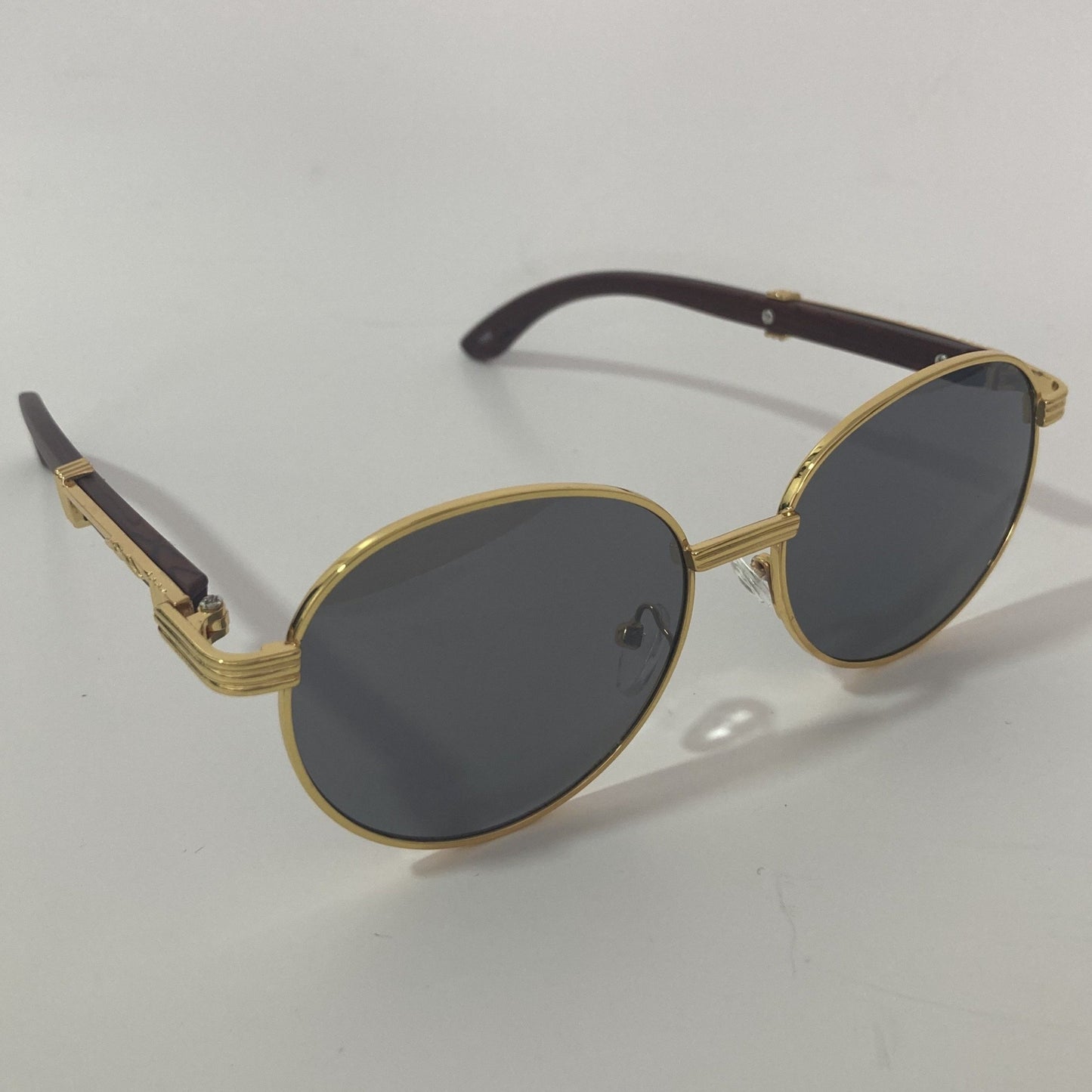 womens and mens gold and black round sunglasses