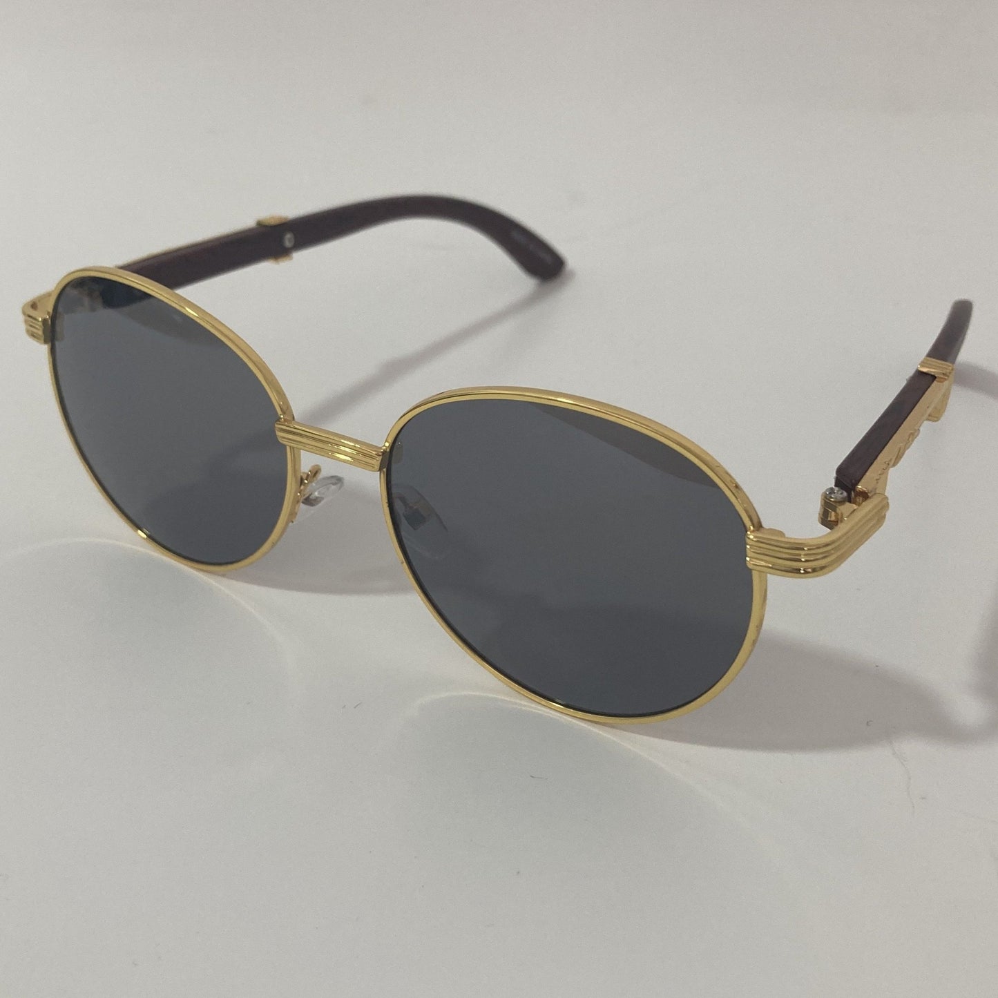 womens and mens gold and black round sunglasses