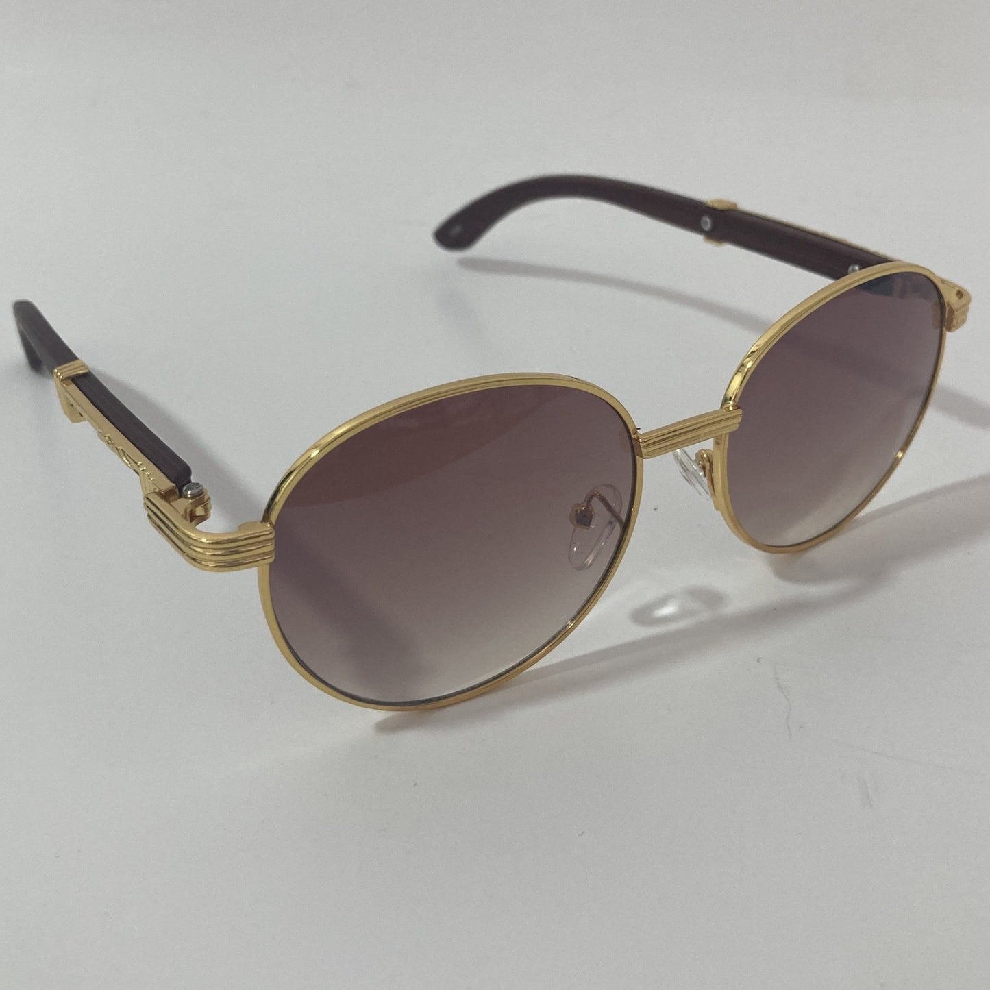 womens and mens gold and brown round sunglasses