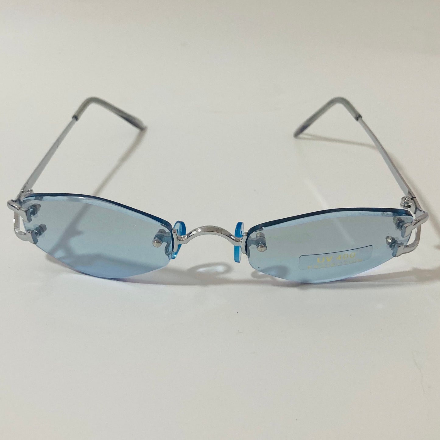 mens and womens silver and blue small rimless sunglasses
