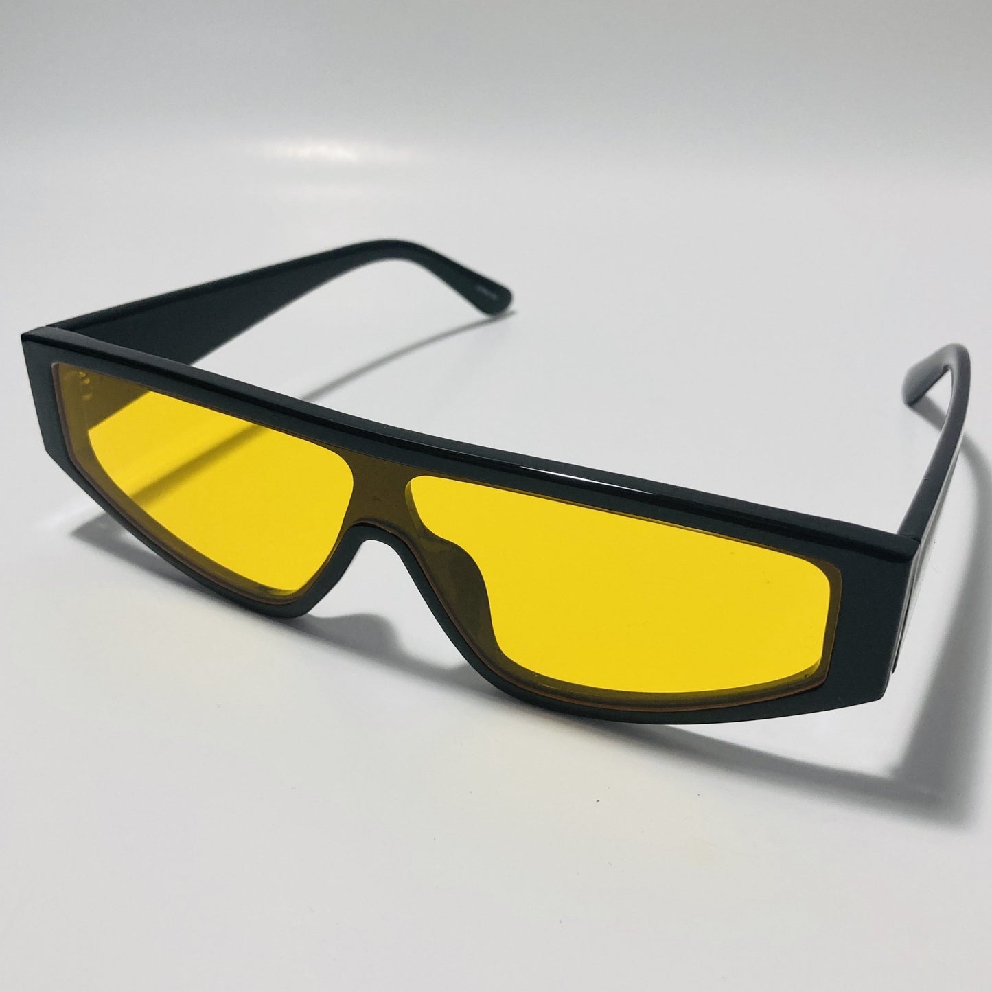 mens and womens black futuristic sunglasses with yellow lenses