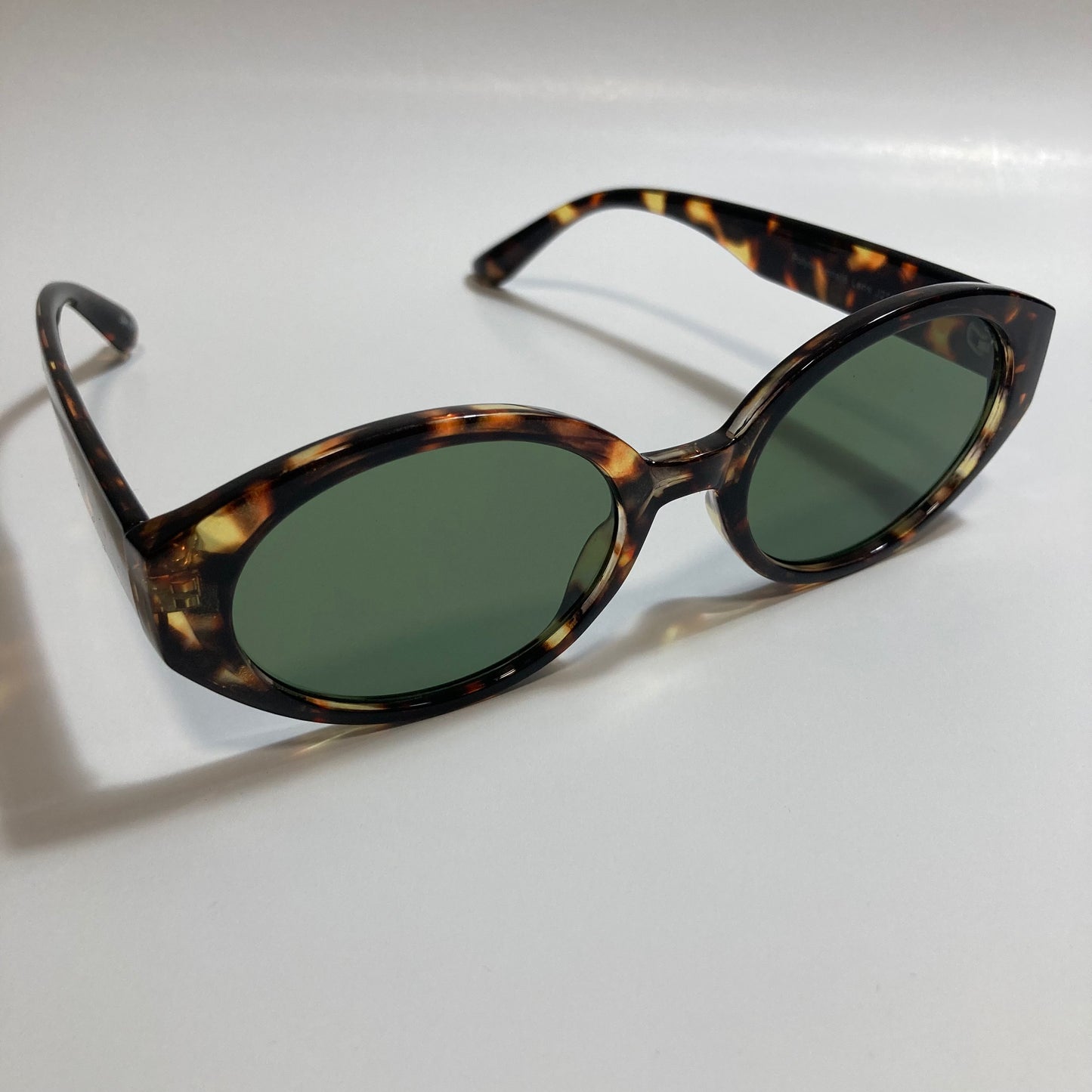 brown and green womens round sunglasses
