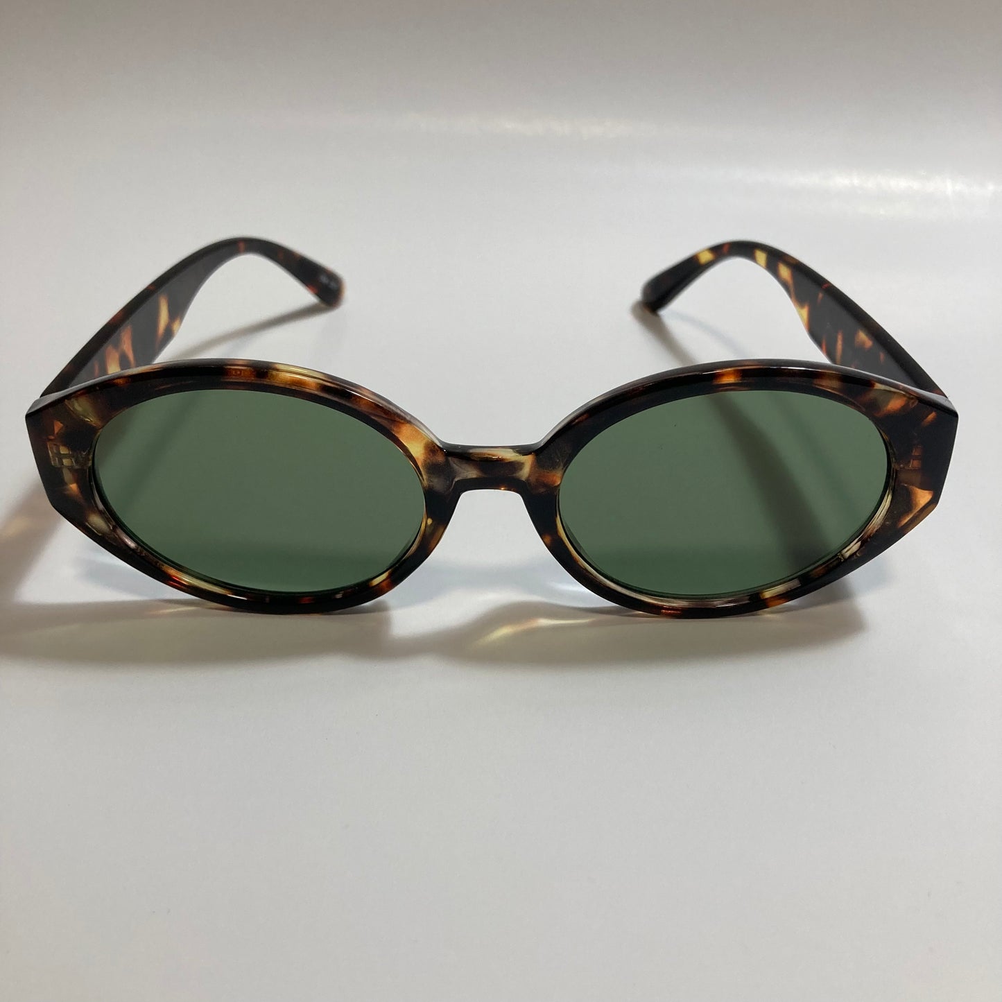 brown and green womens round sunglasses