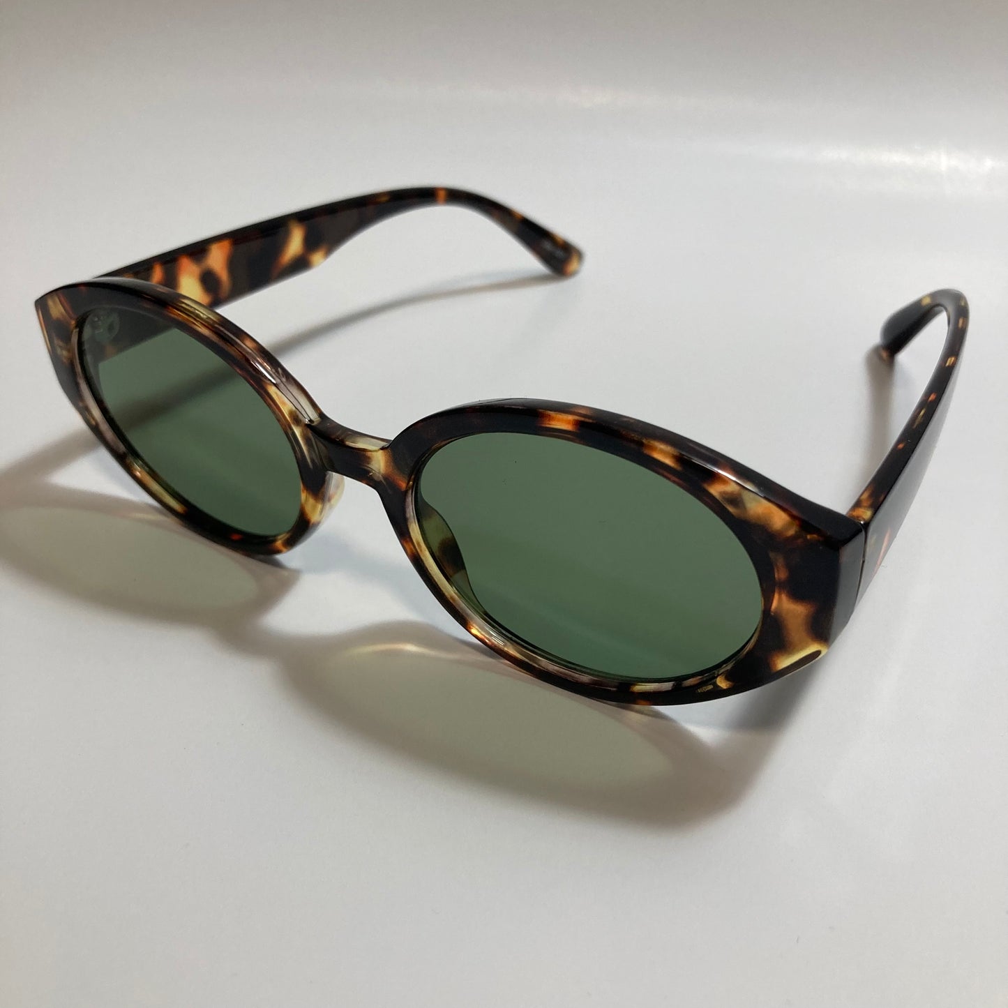 brown and green womens round sunglasses