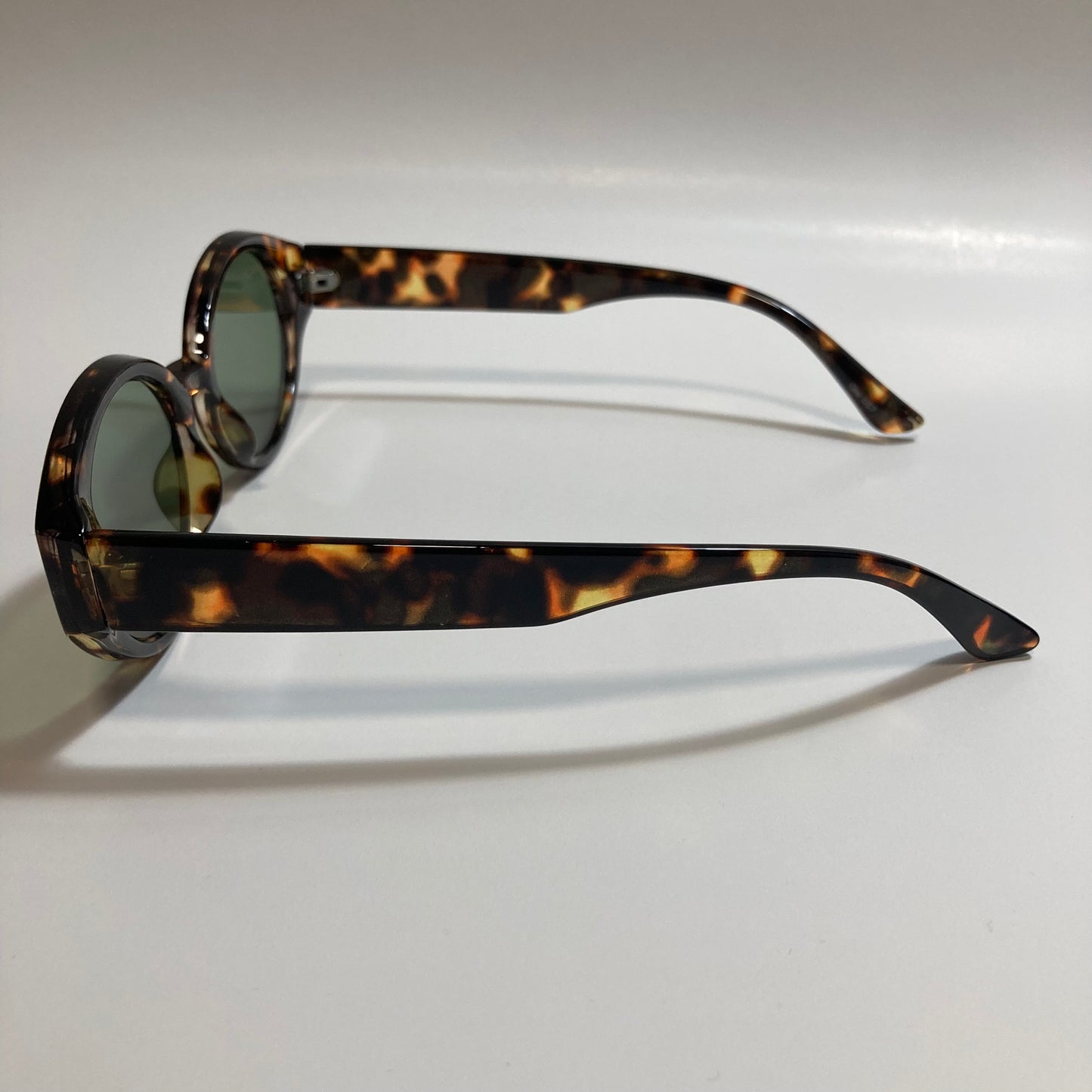 brown and green womens round sunglasses