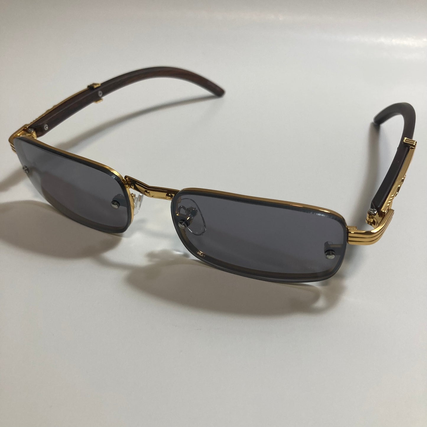 mens and womens black and gold square sunglasses