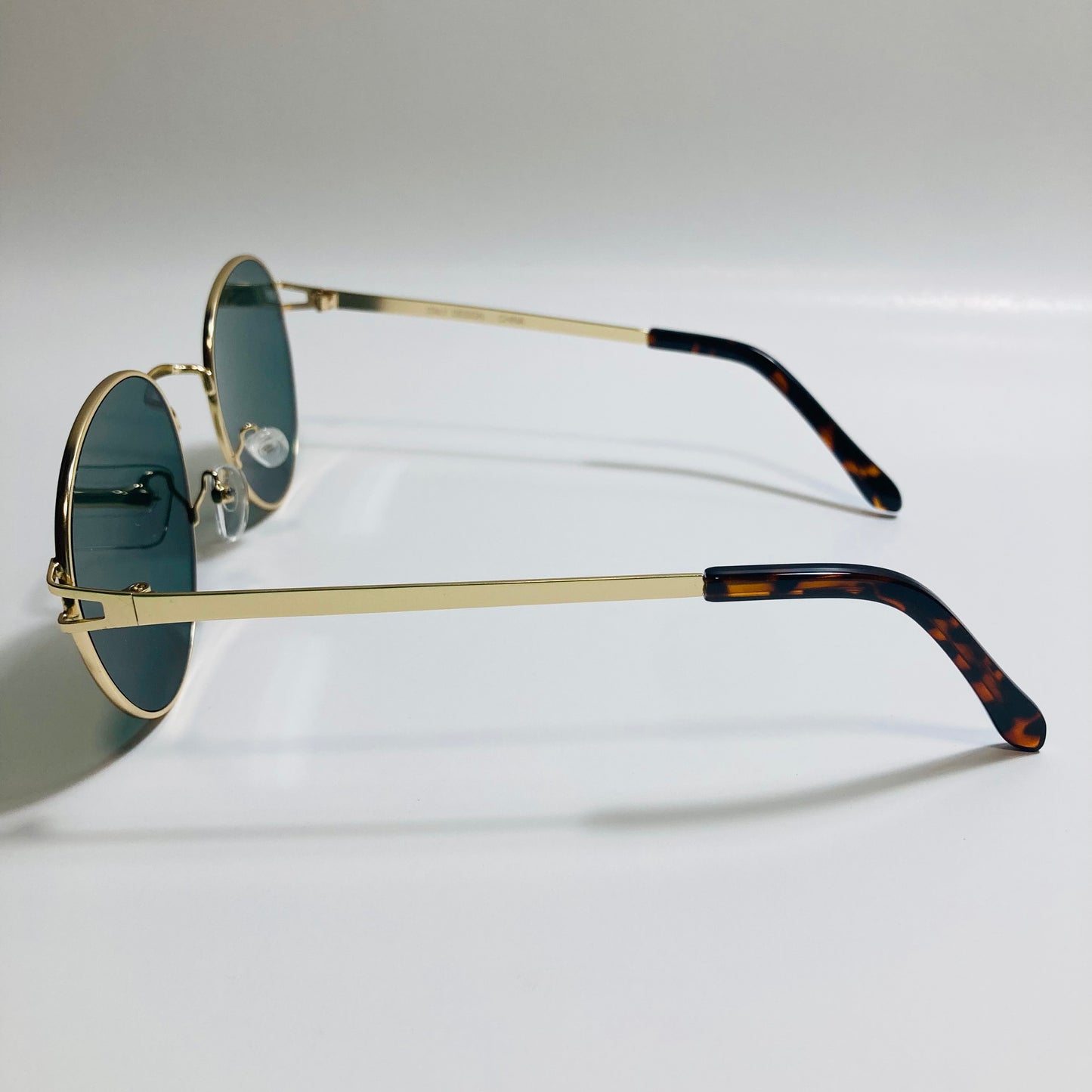 mens and womens gold and green metal round sunglasses