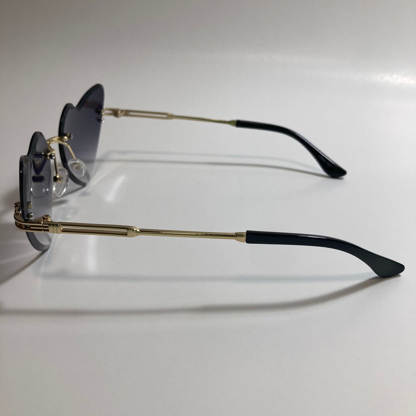 gold womens rimless heart shape sunglasses with black lenses