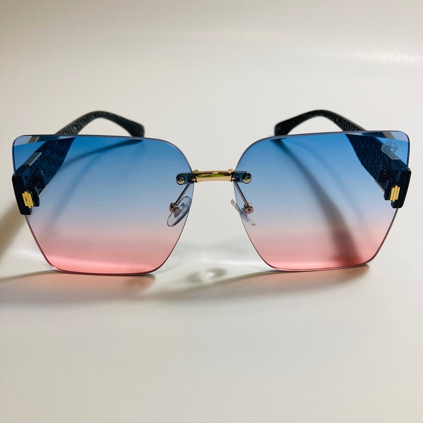 womens pink and blue square rimless oversize sunglasses