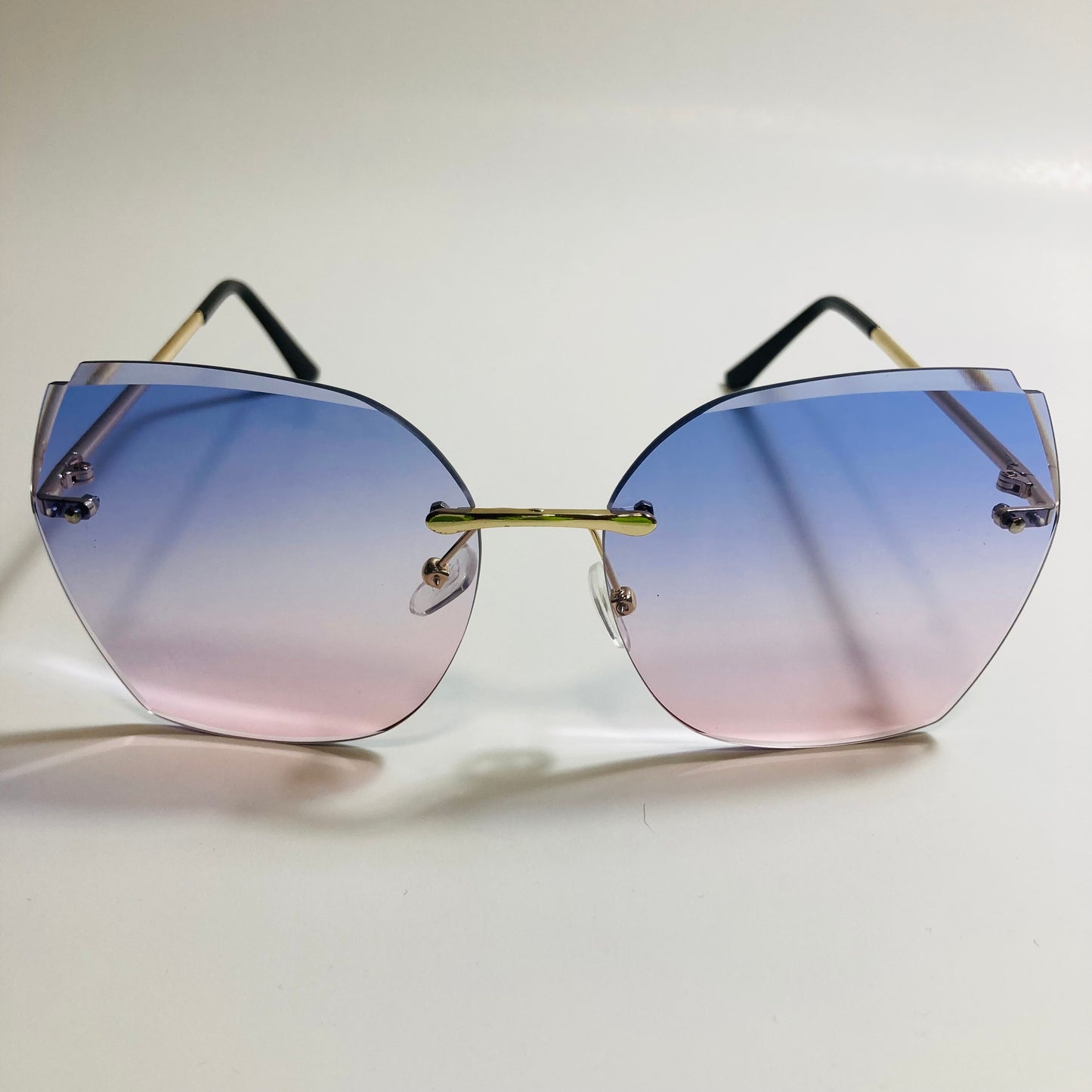 womens blue and pink oversize rimless sunglasses