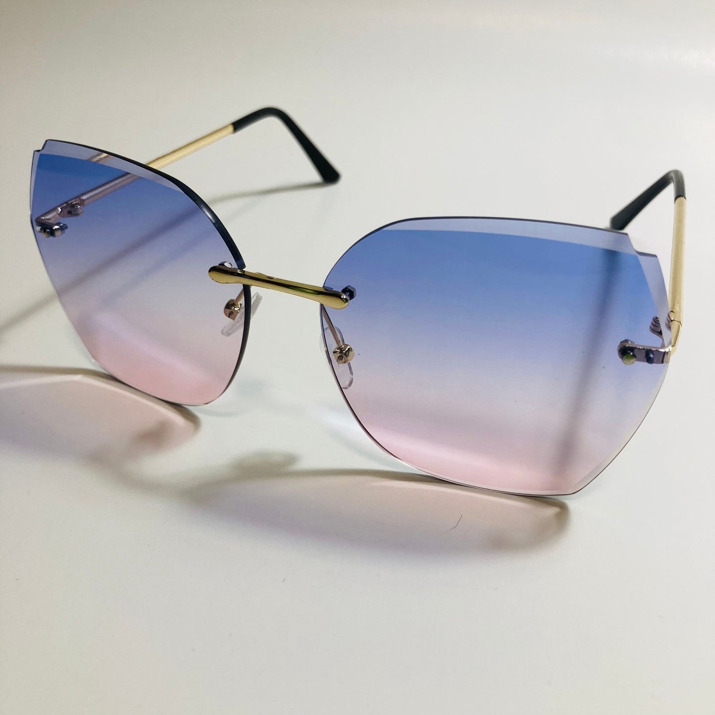 womens blue and pink oversize rimless sunglasses