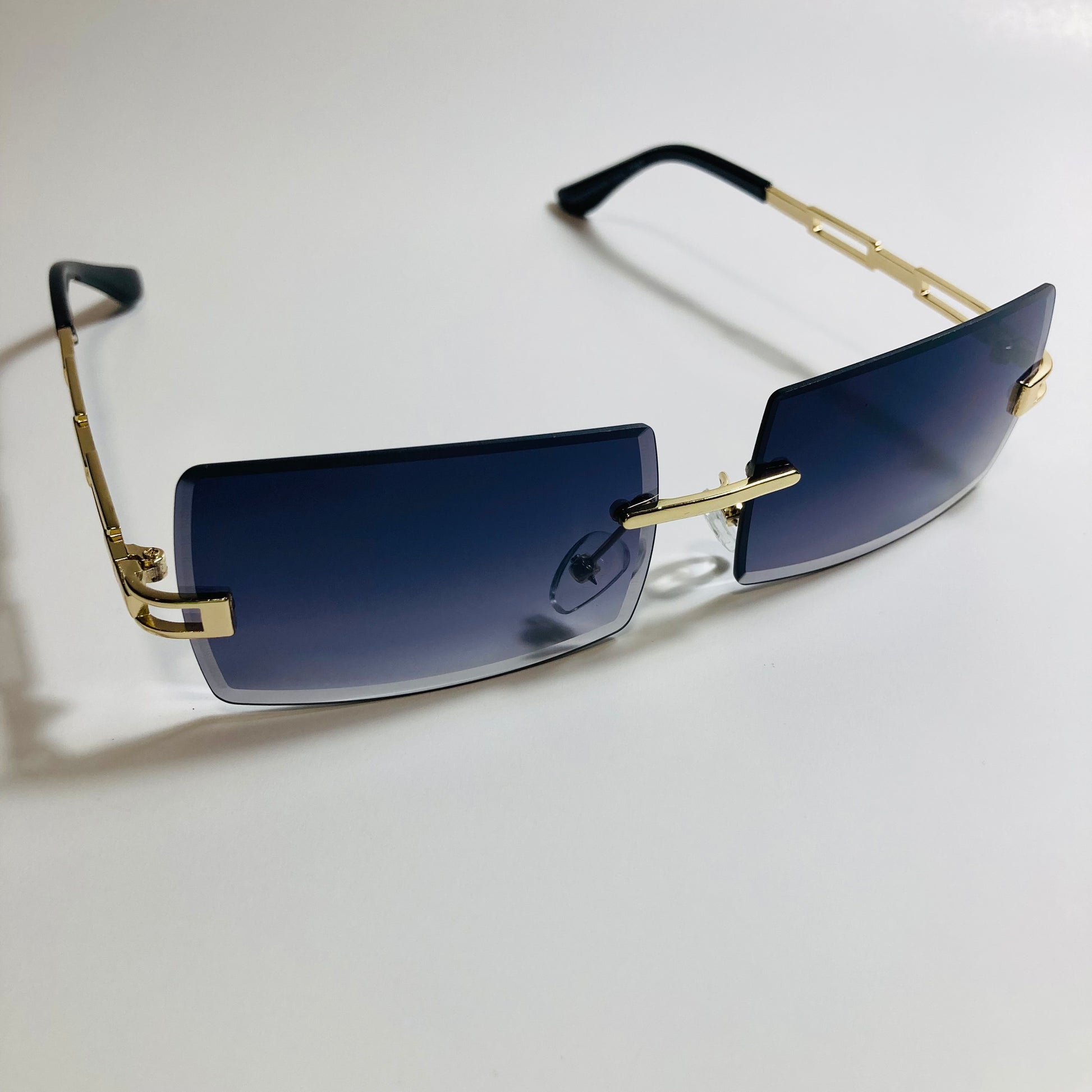 mens and womens black and gold rimless square sunglasses