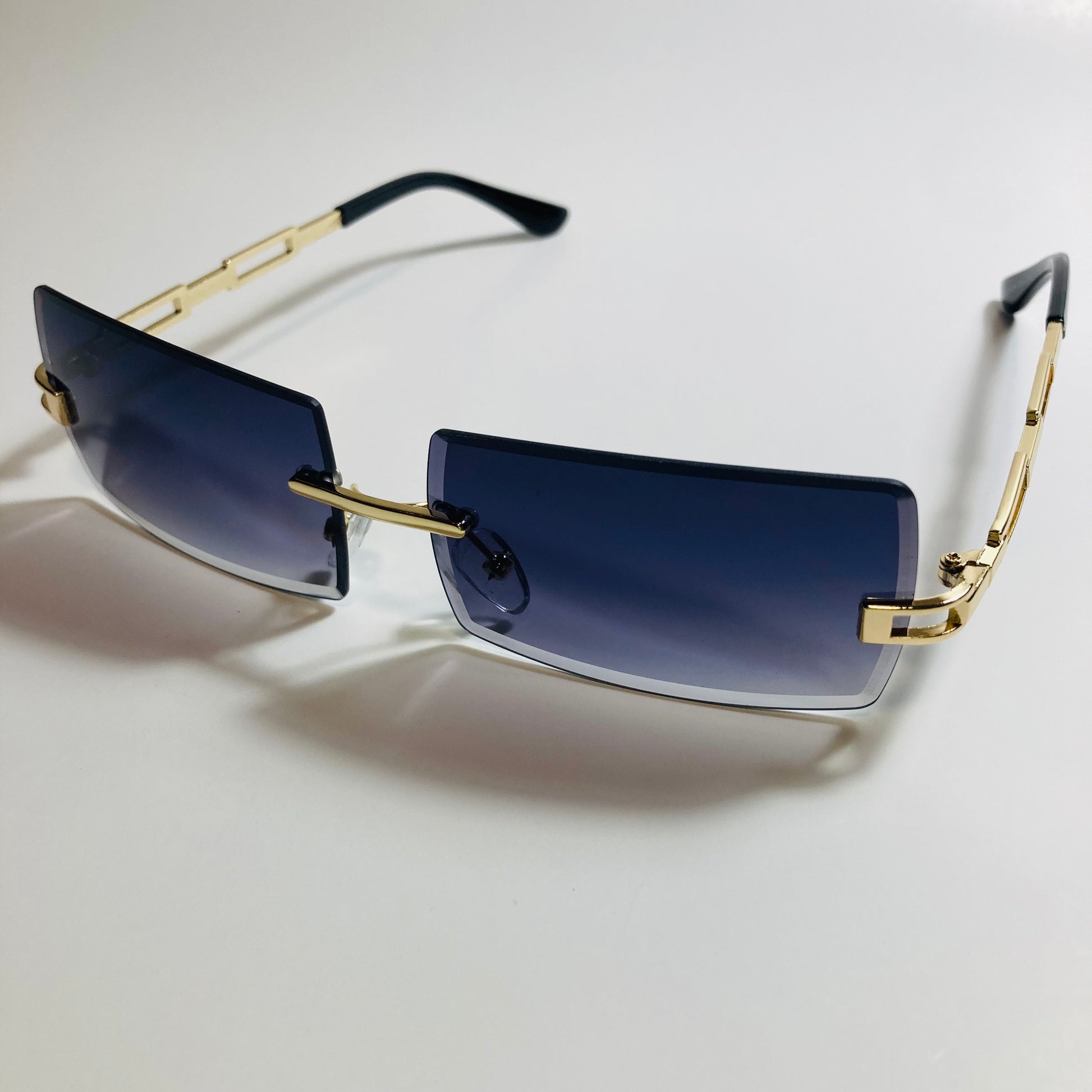 mens and womens black and gold rimless square sunglasses