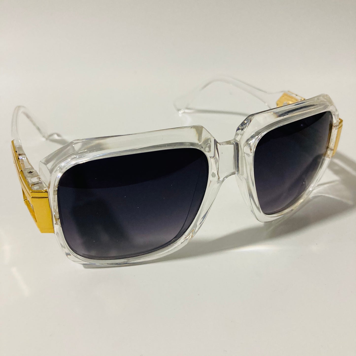 mens and womens clear black and gold gazelle sunglasses