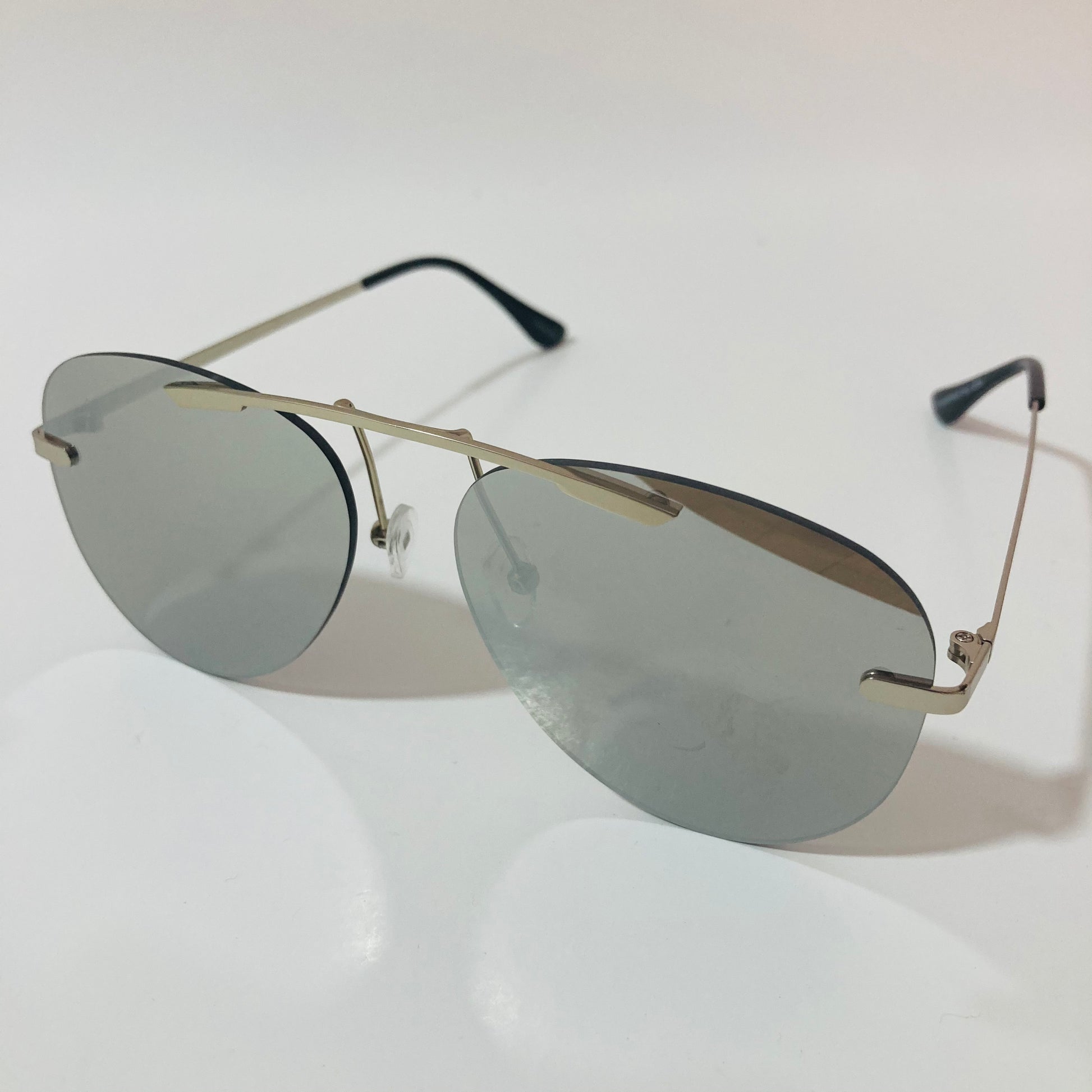 silver rimless aviator sunglasses with silver mirror lenses