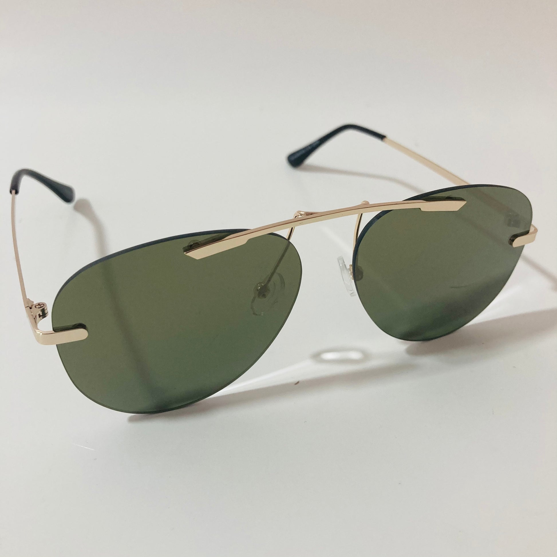 gold rimless aviator sunglasses with green mirror lenses