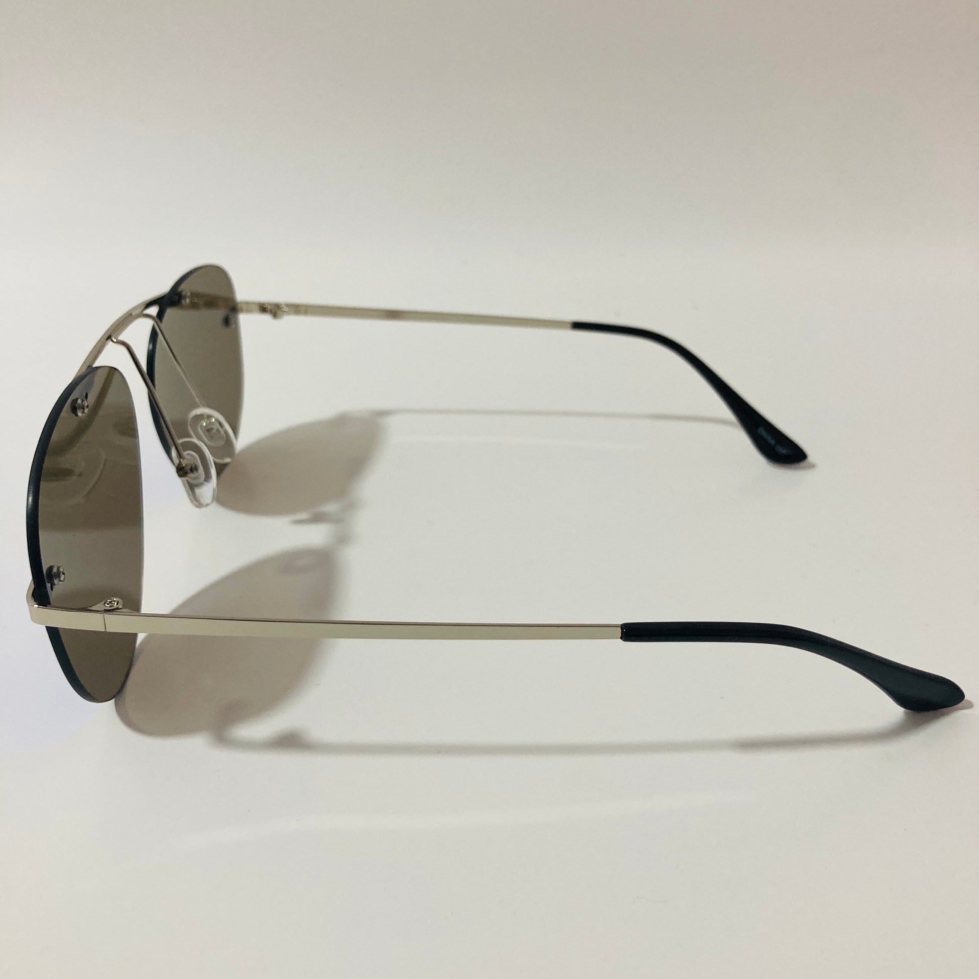 silver rimless aviator sunglasses with blue mirror lenses