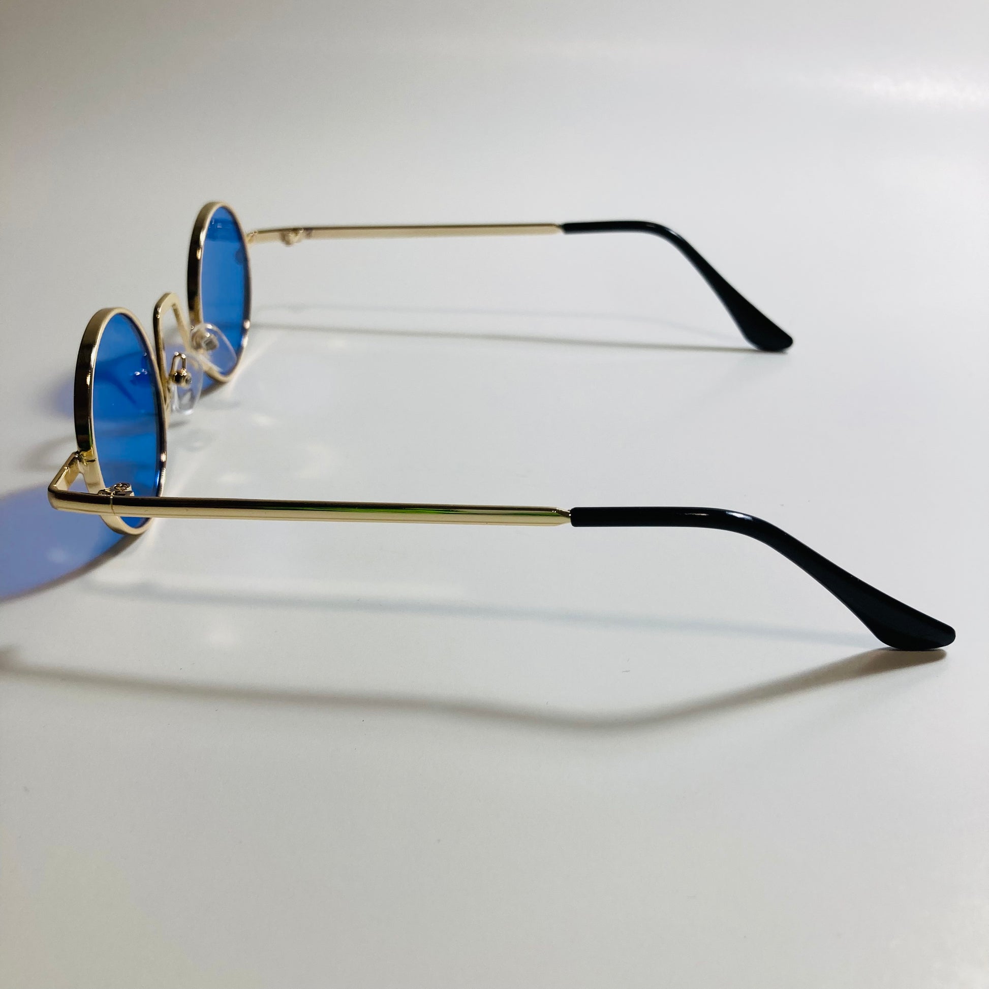 womens and mens gold and blue ozzy osbourne sunglasses