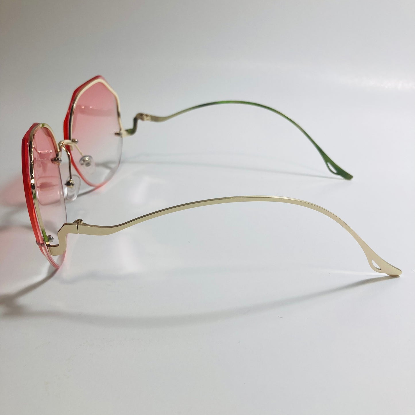 womens pink and gold rimless sunglasses