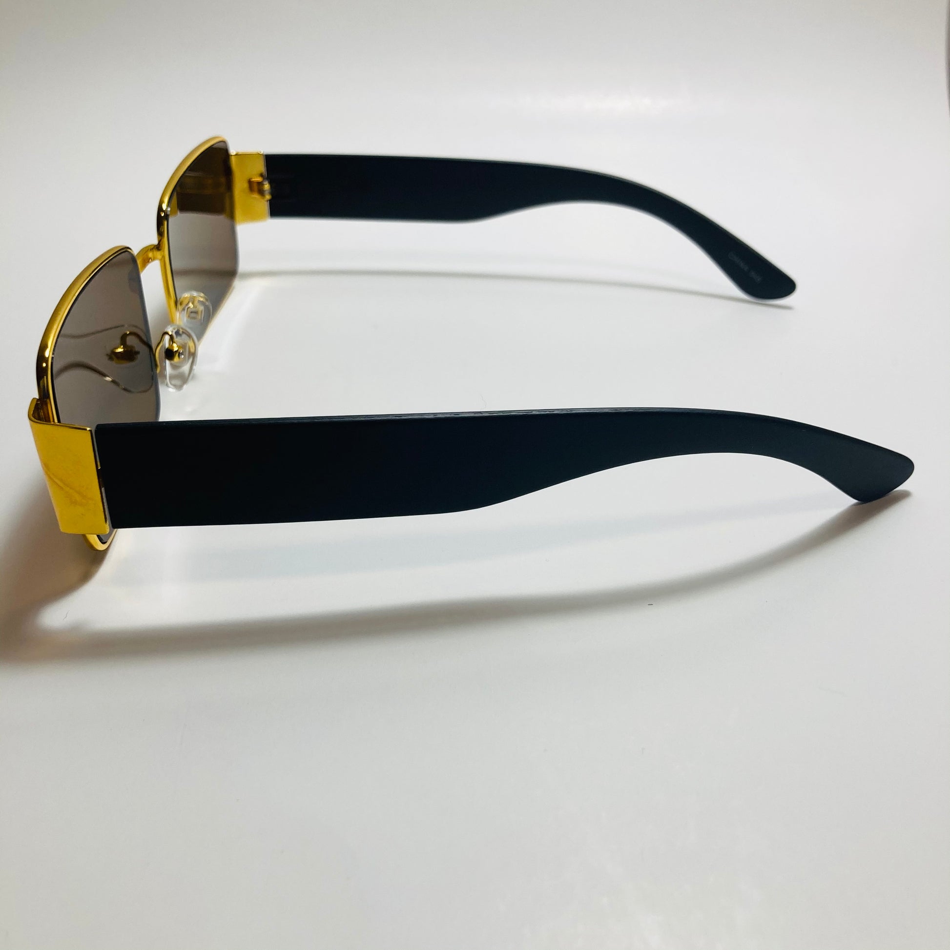 mens and womens brown and gold square sunglasses