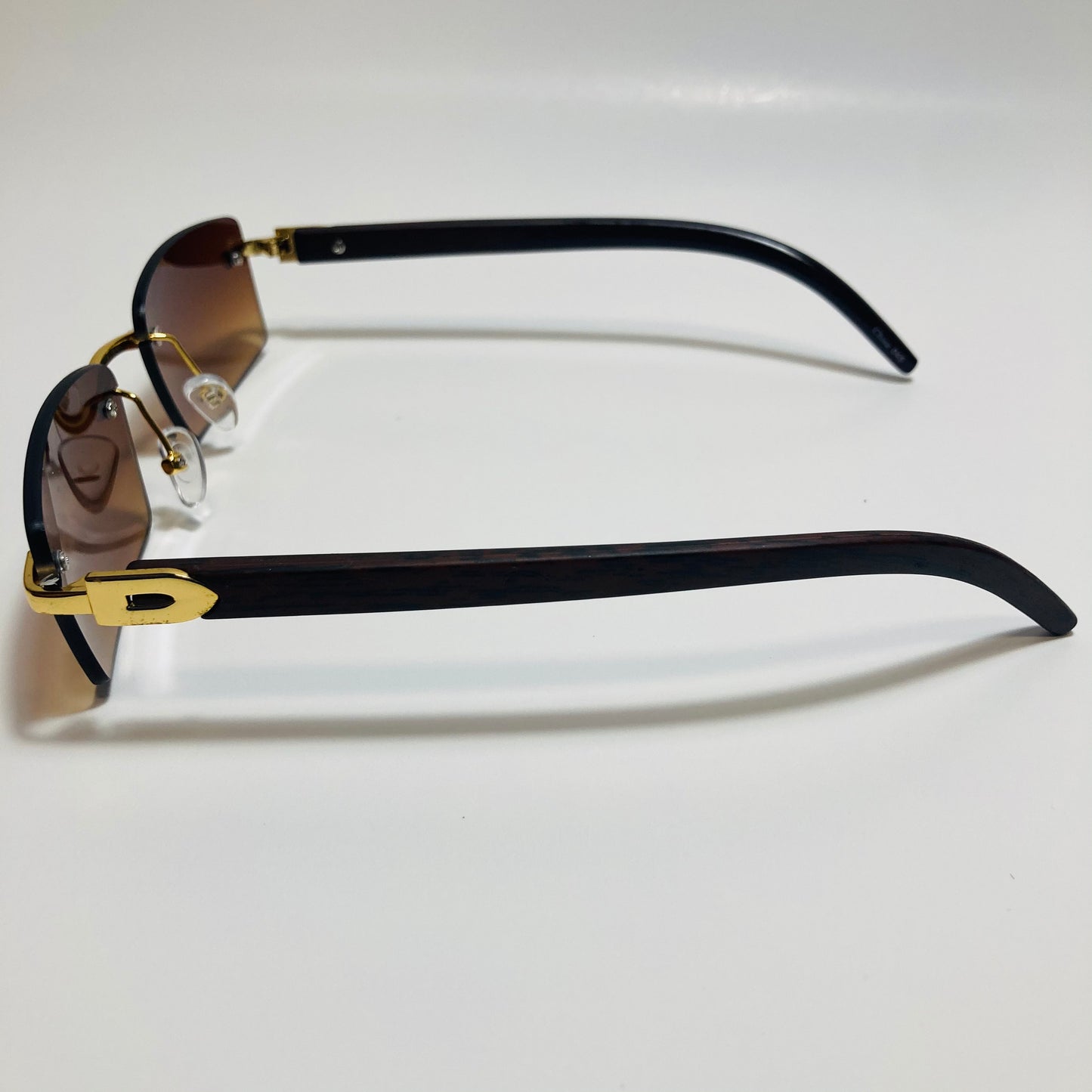 mens and womens brown and gold rimless square sunglasses