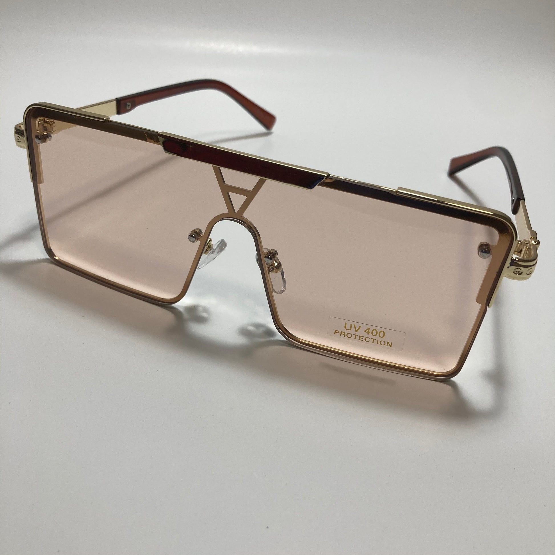 womens gold square oversize sunglasses with pink lenses