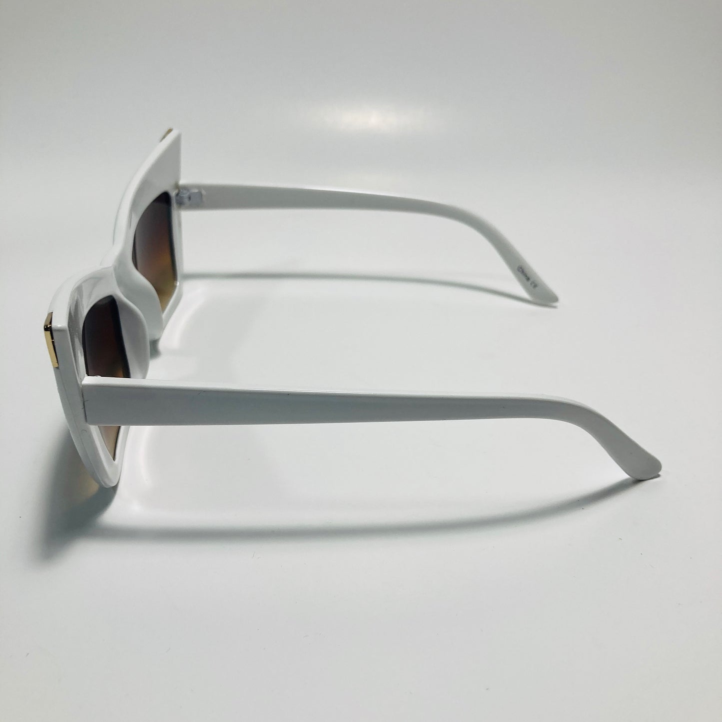 white and brown goth sunglasses