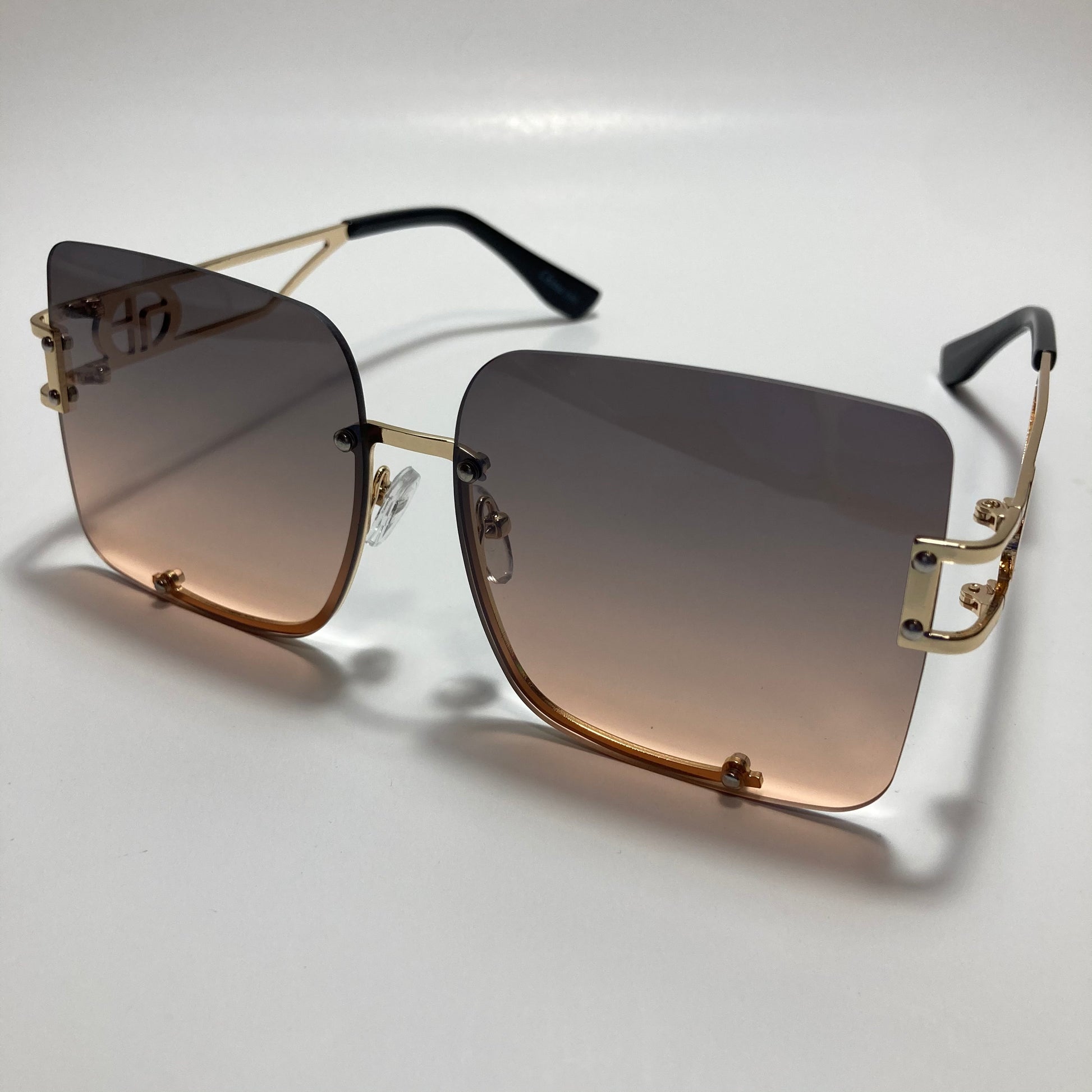 womens oversize square black and pink rimless sunglasses