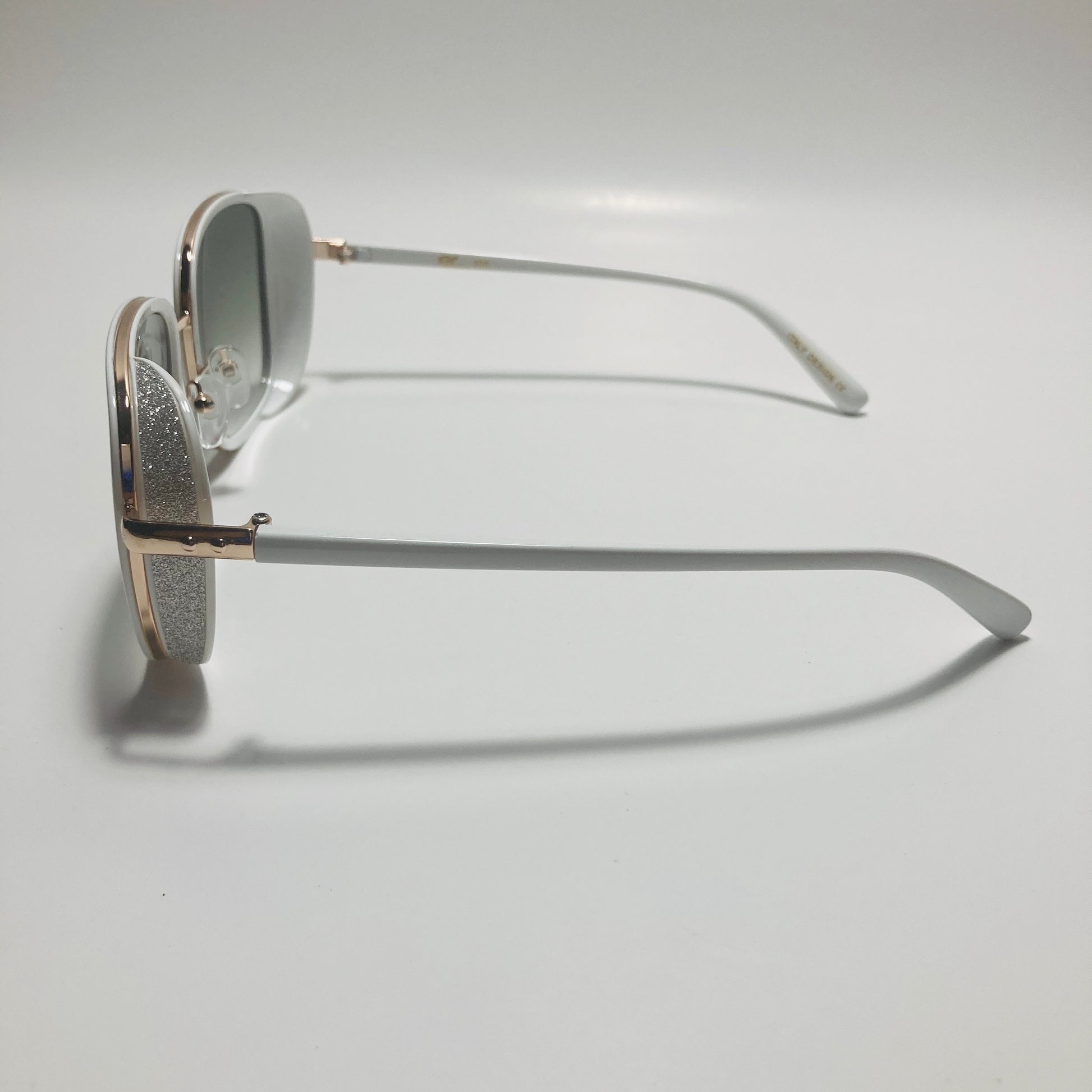 white and green elton john sunglasses