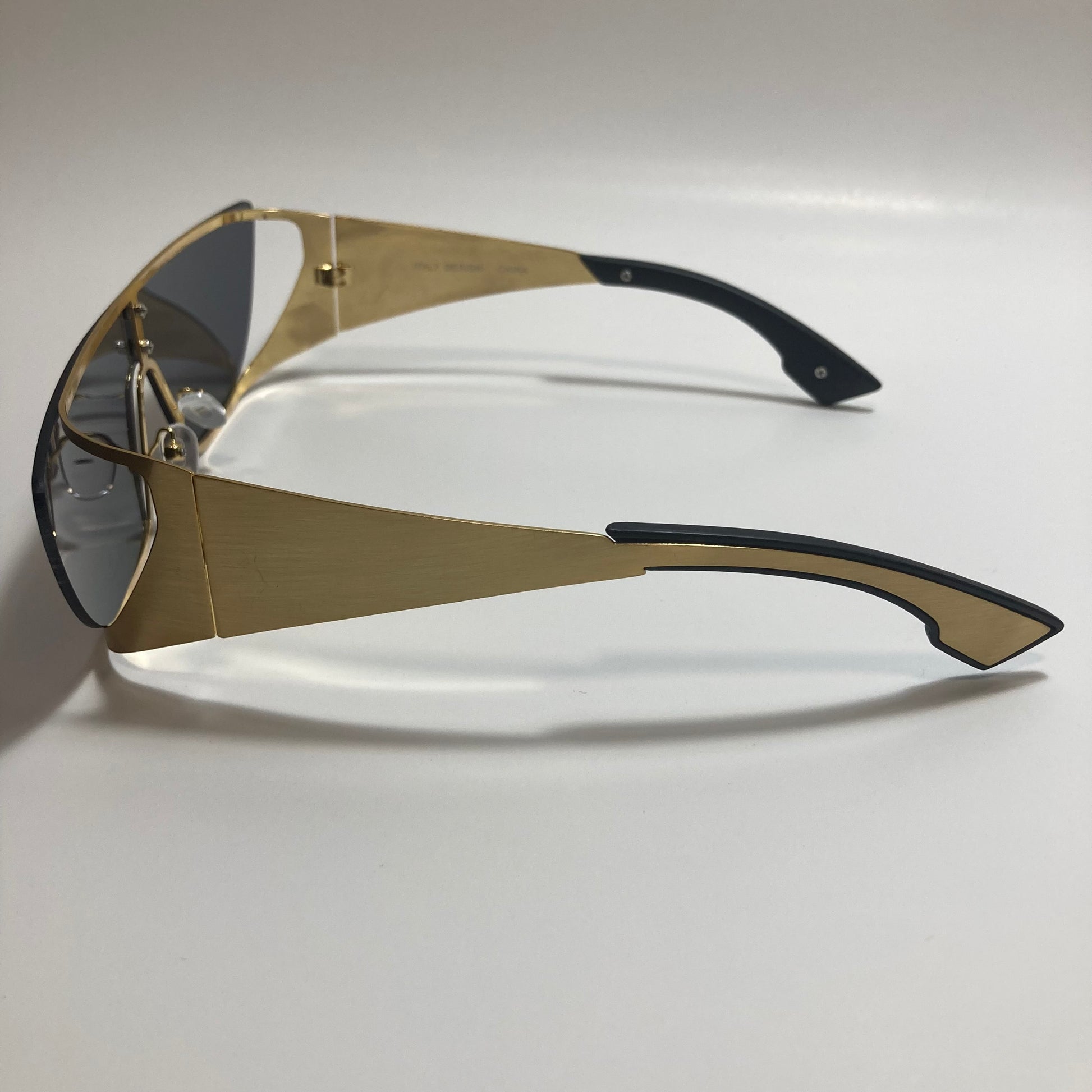 black and gold futuristic sunglasses