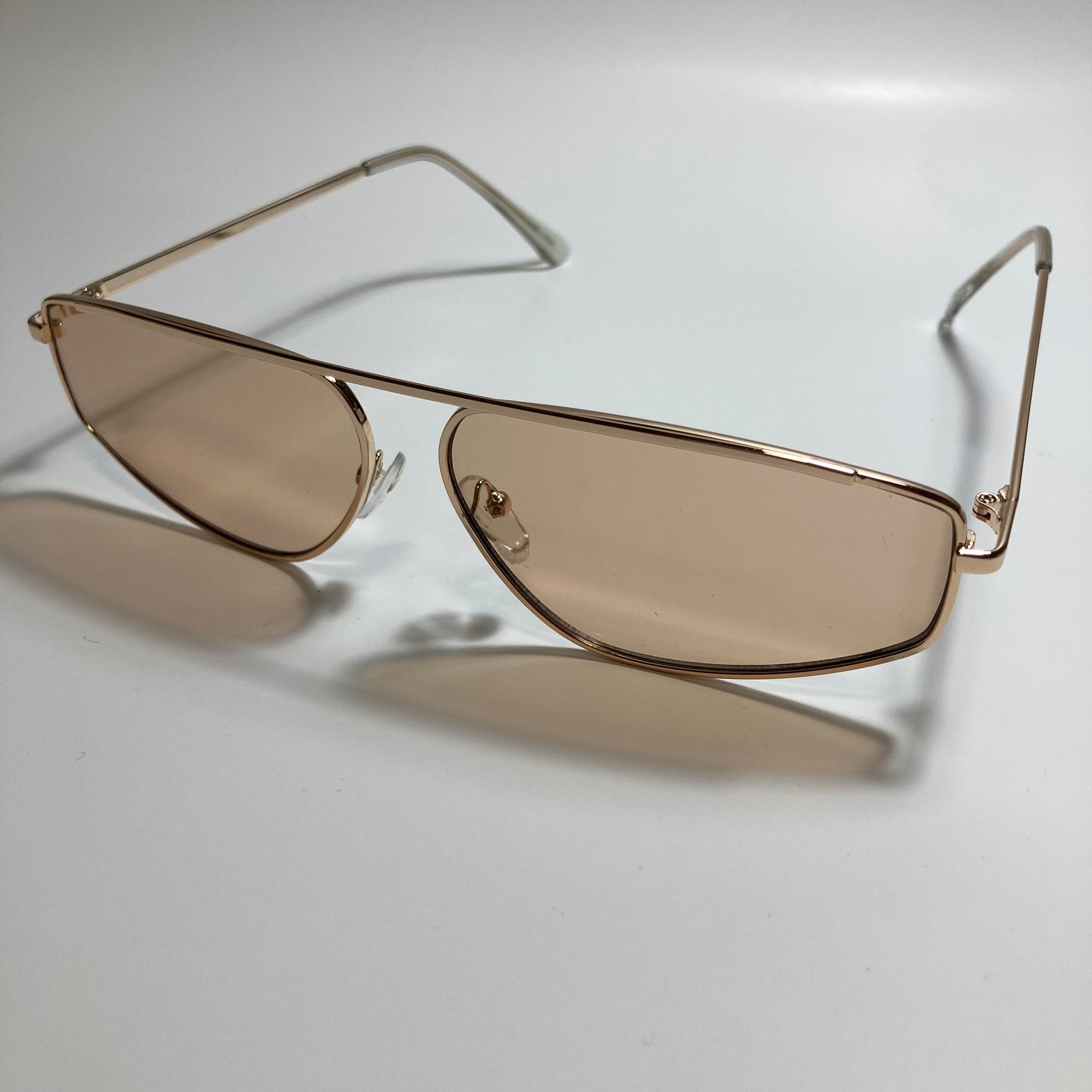 mens and womens brown and gold futuristic sunglasses