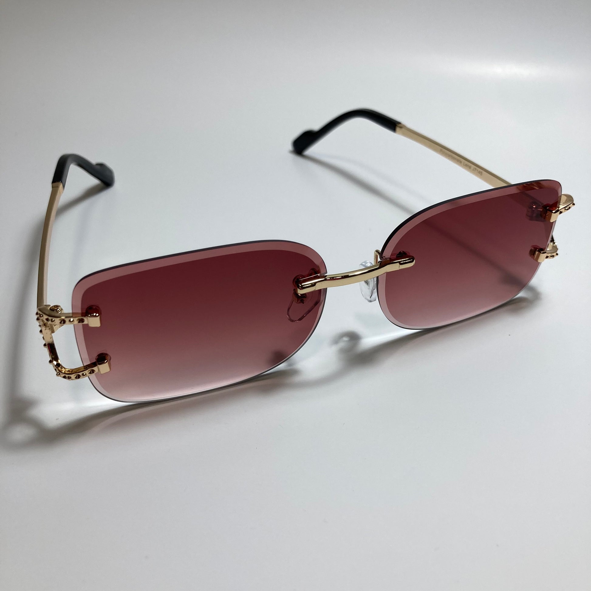 mens and womens red and gold rimless square sunglasses