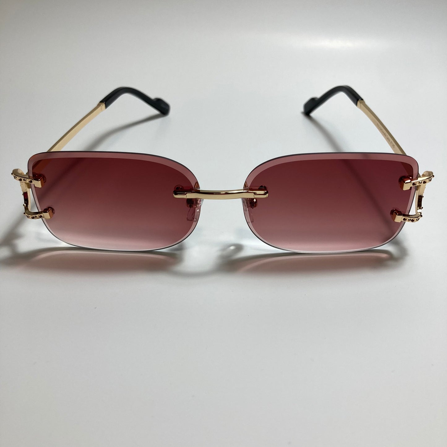 mens and womens red and gold rimless square sunglasses