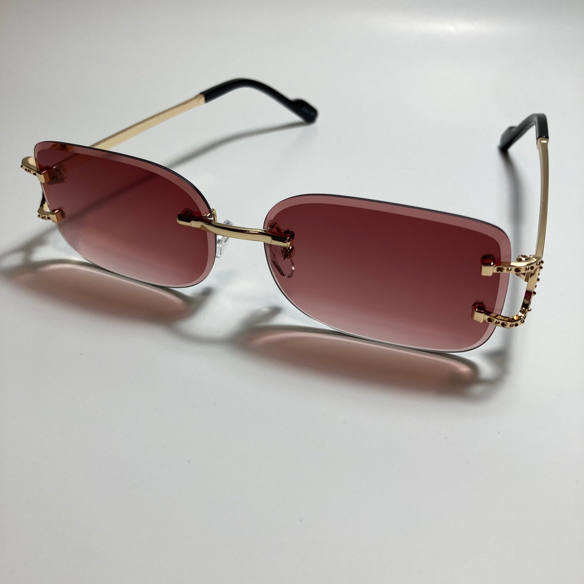 mens and womens red and gold rimless square sunglasses