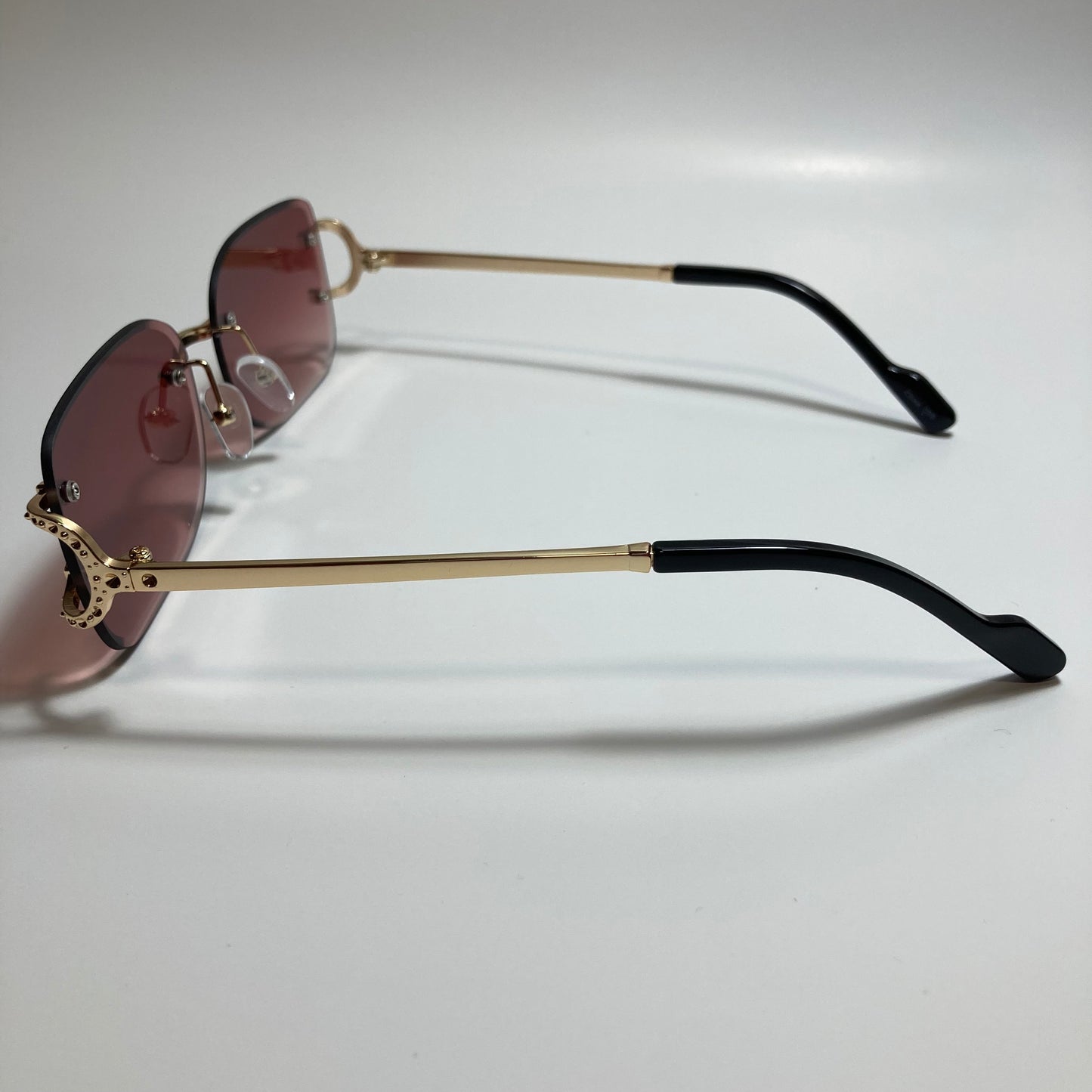 mens and womens red and gold rimless square sunglasses