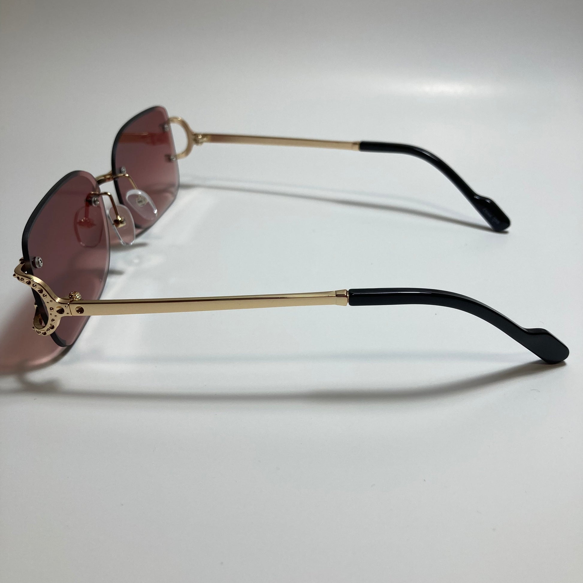 mens and womens red and gold rimless square sunglasses