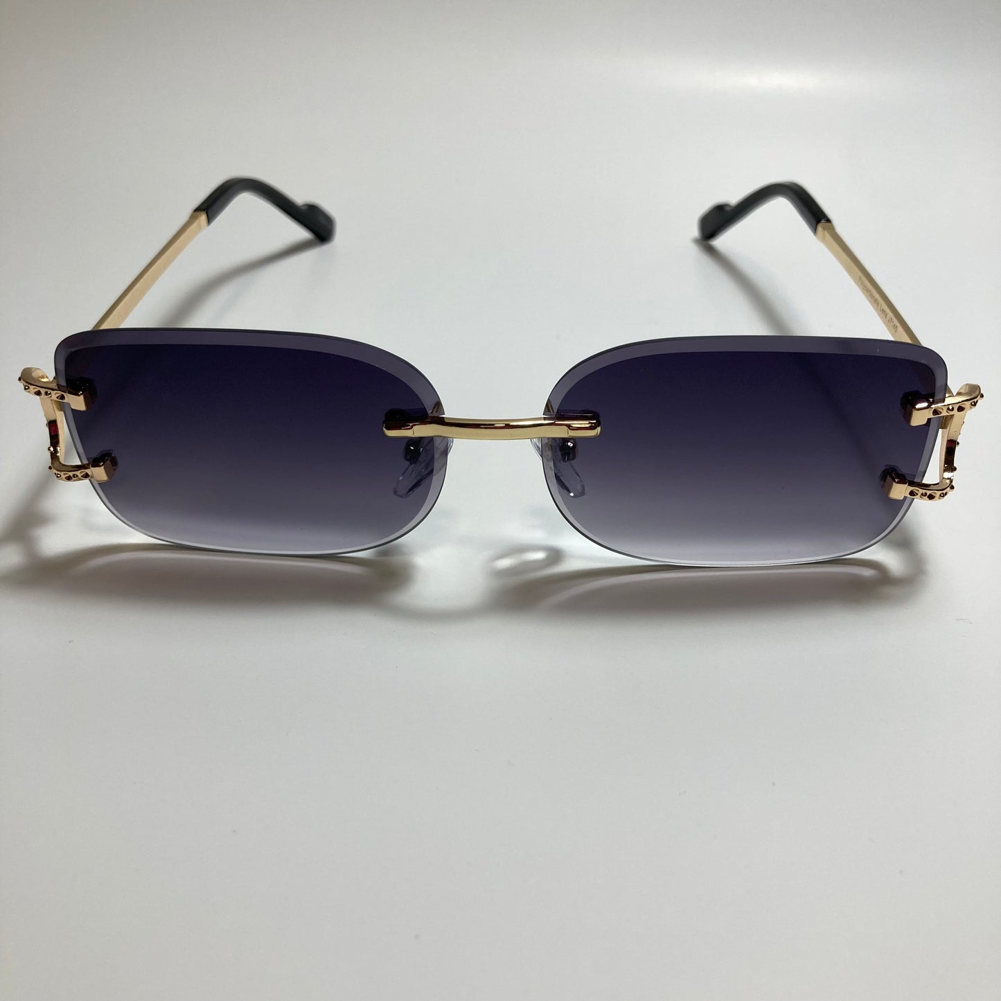 mens and womens black and gold rimless square sunglasses