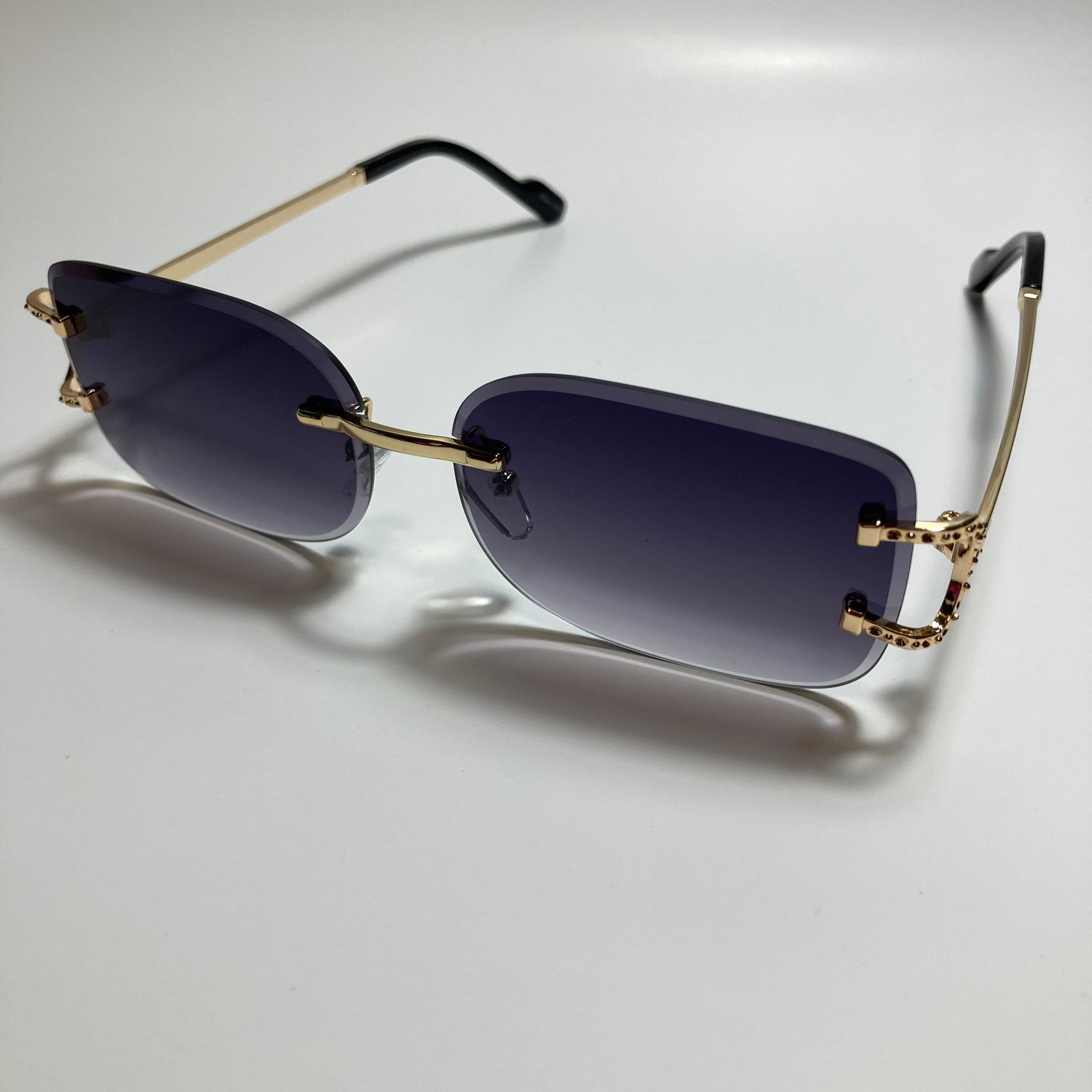 mens and womens black and gold rimless square sunglasses