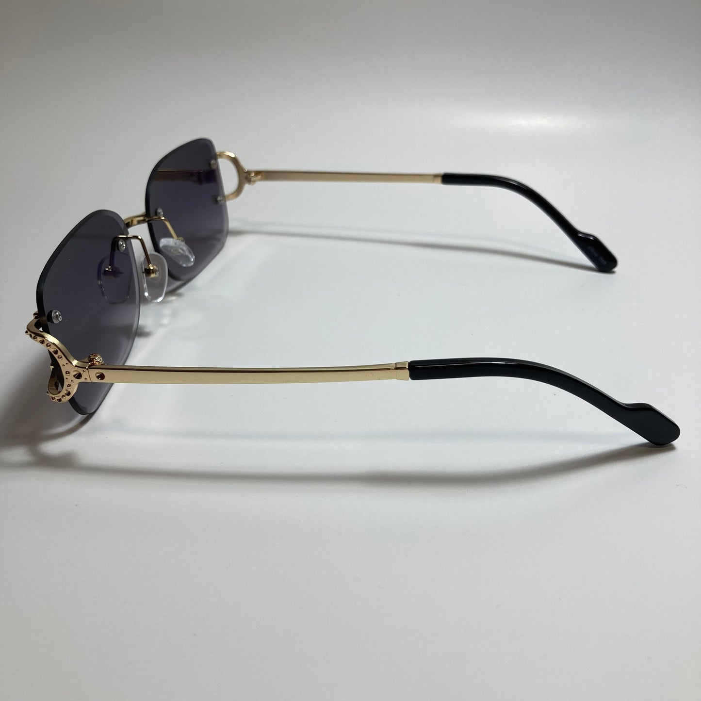 mens and womens black and gold rimless square sunglasses