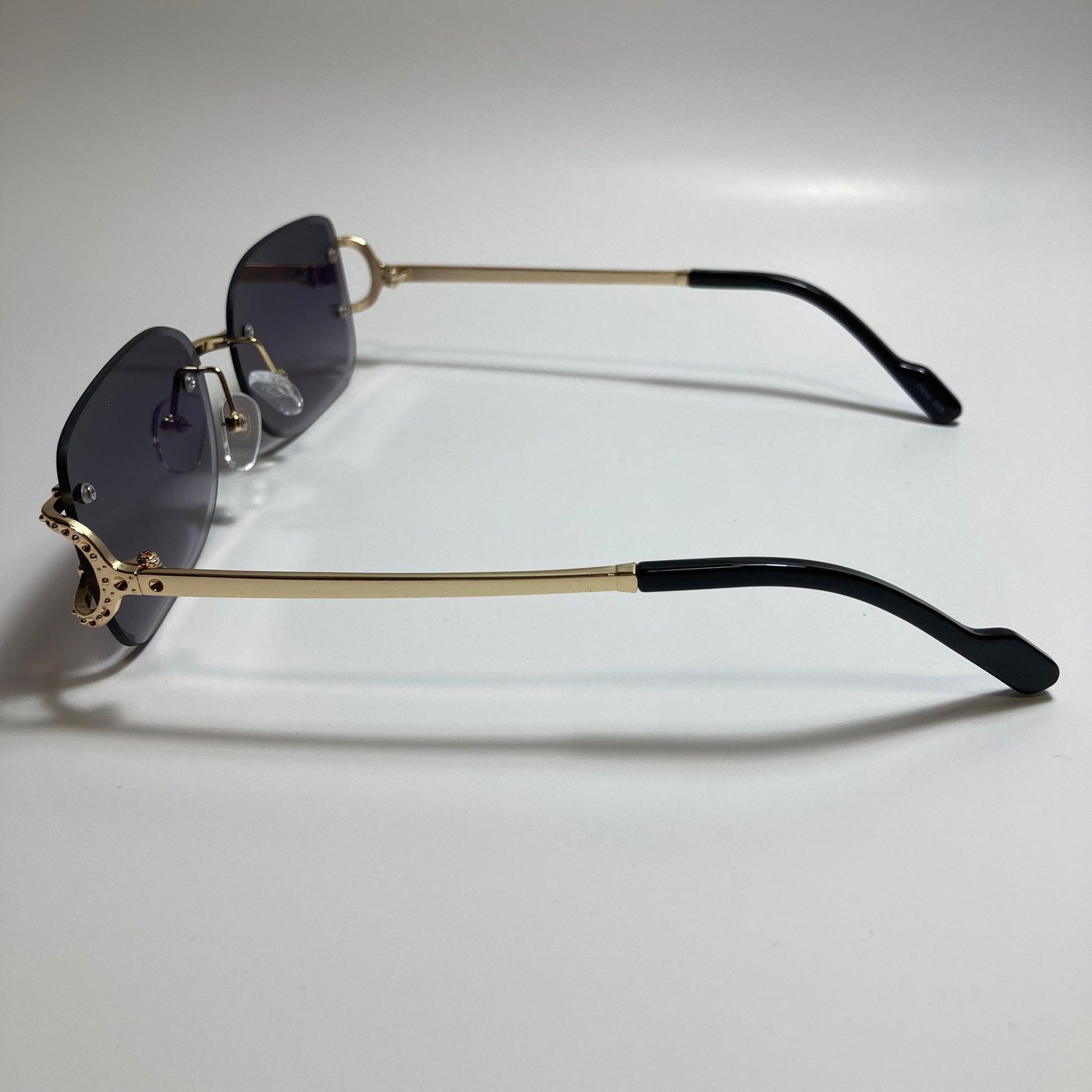 mens and womens black and gold rimless square sunglasses