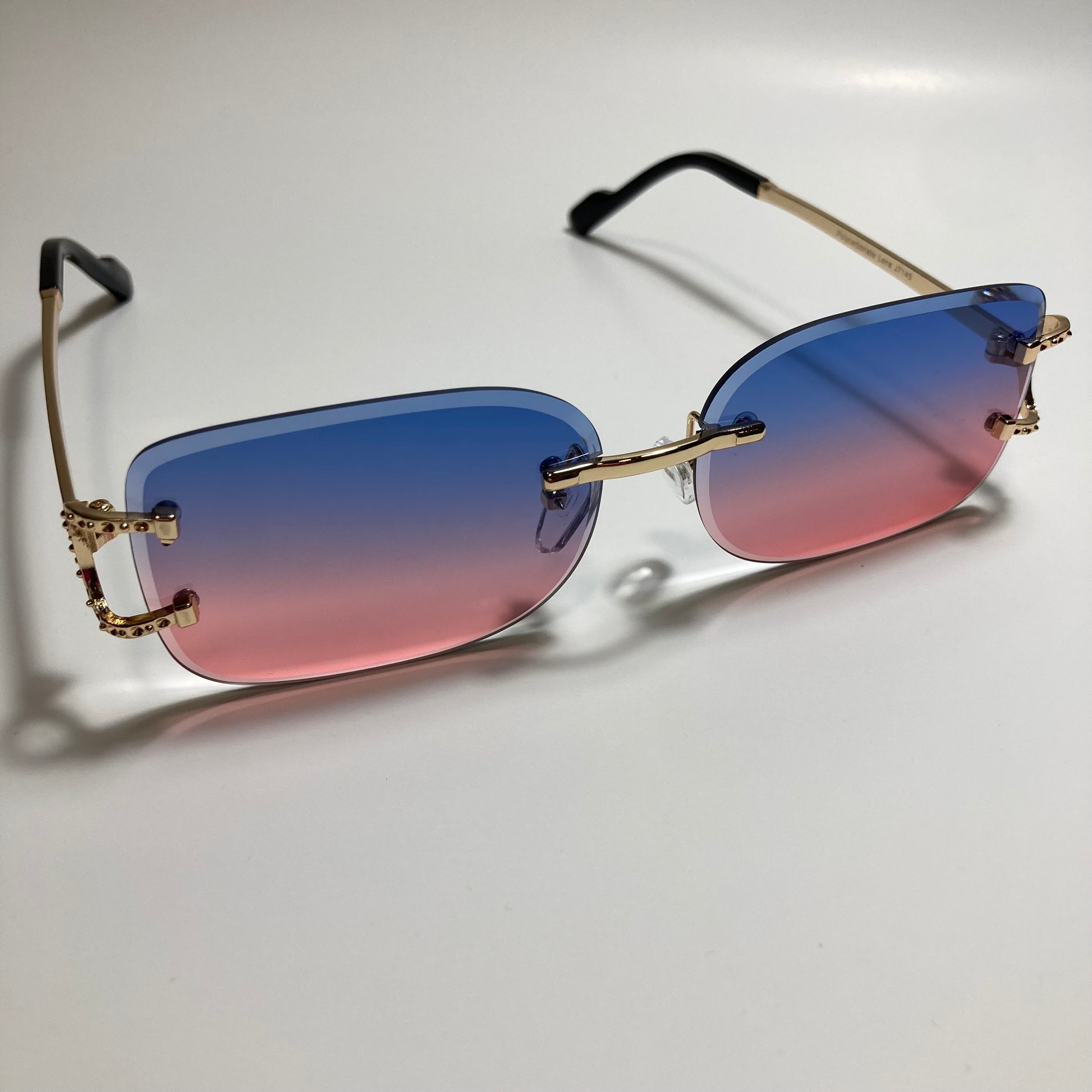mens and womens pink blue and gold rimless square sunglasses